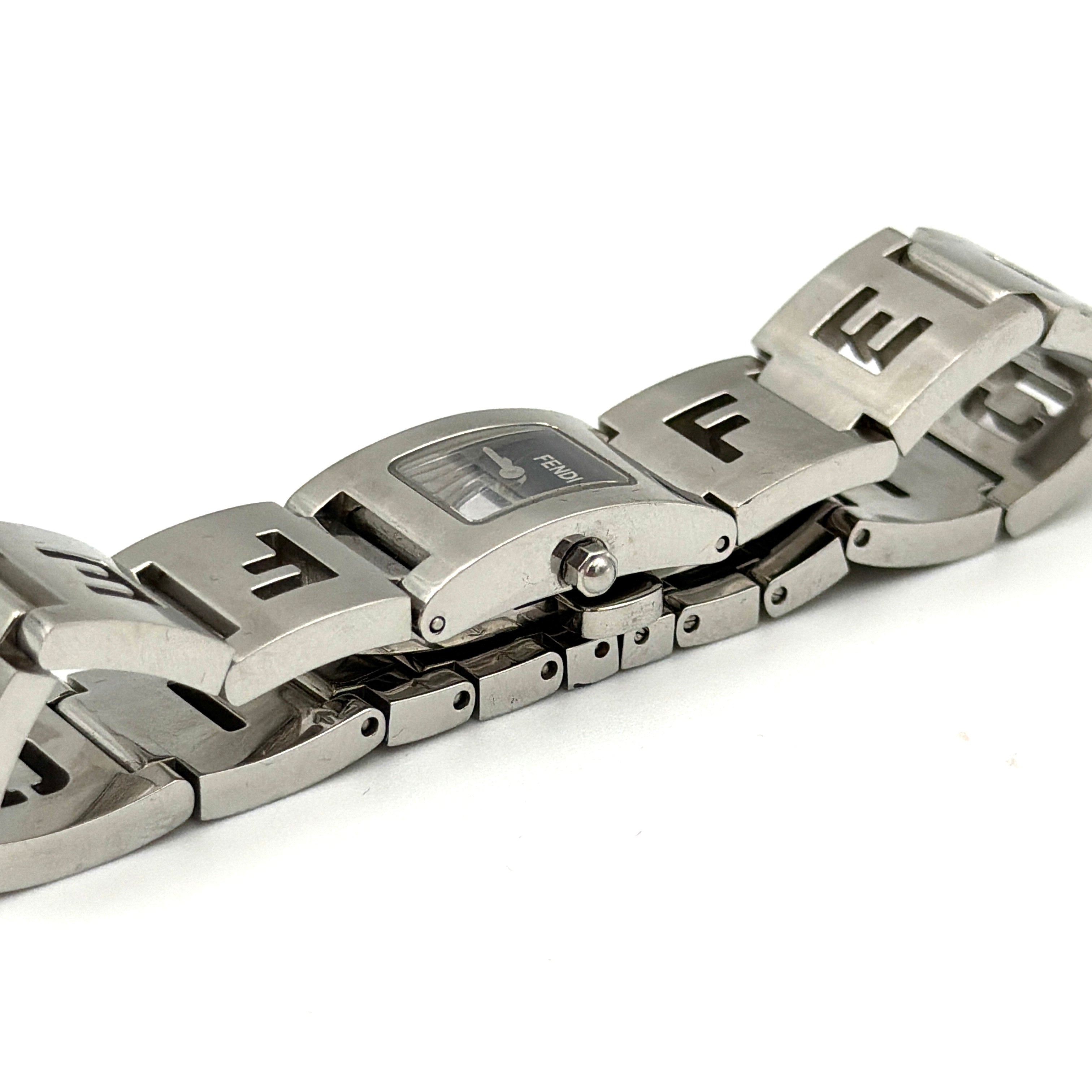Fendi 3150L FF Logo Belt Watch in silver with a black dial, presented in a black Fendi box with gold logo accents.
