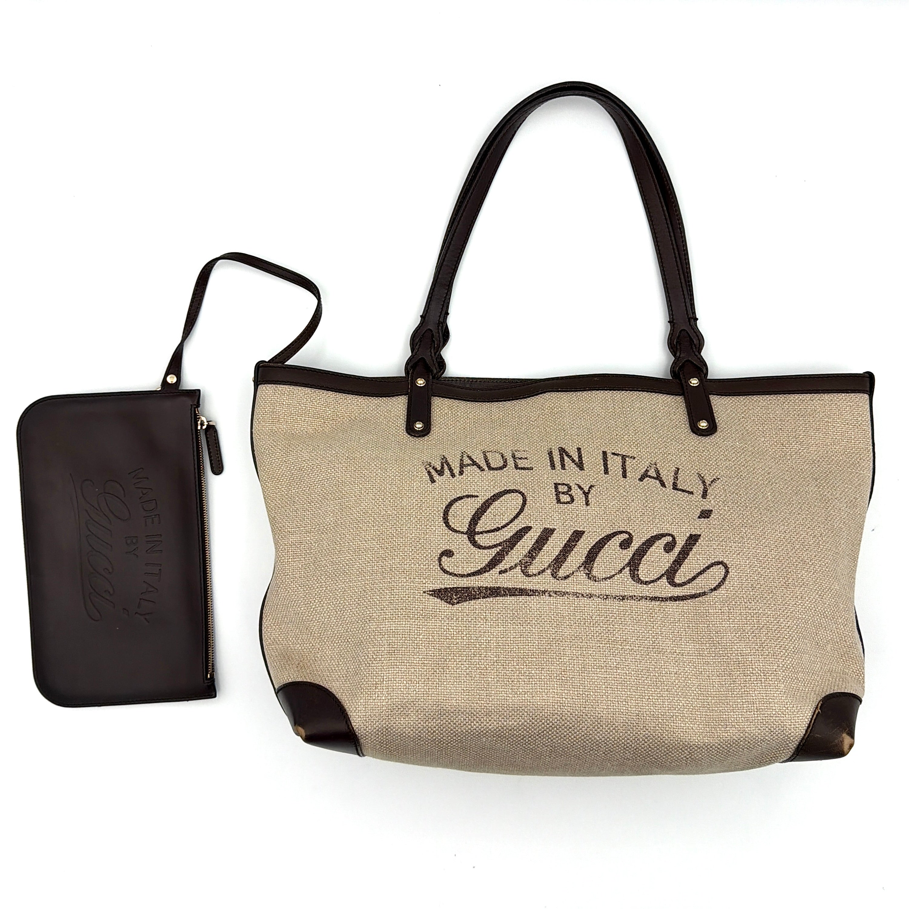 Gucci beige canvas shoulder bag with brown leather trim, bold Gucci logo, and matching detachable leather pouch.