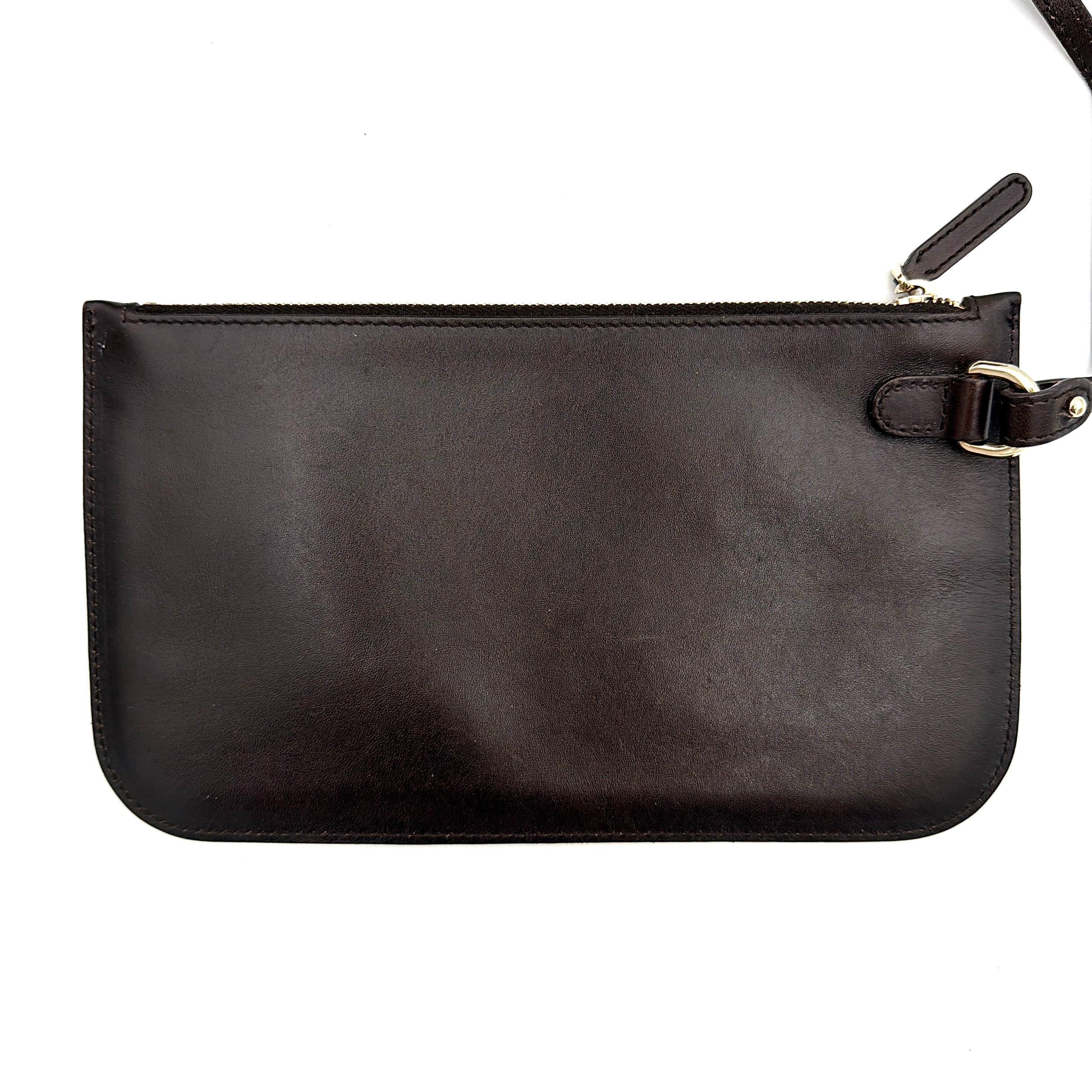 Gucci beige canvas shoulder bag with brown leather trim, bold Gucci logo, and matching detachable leather pouch.