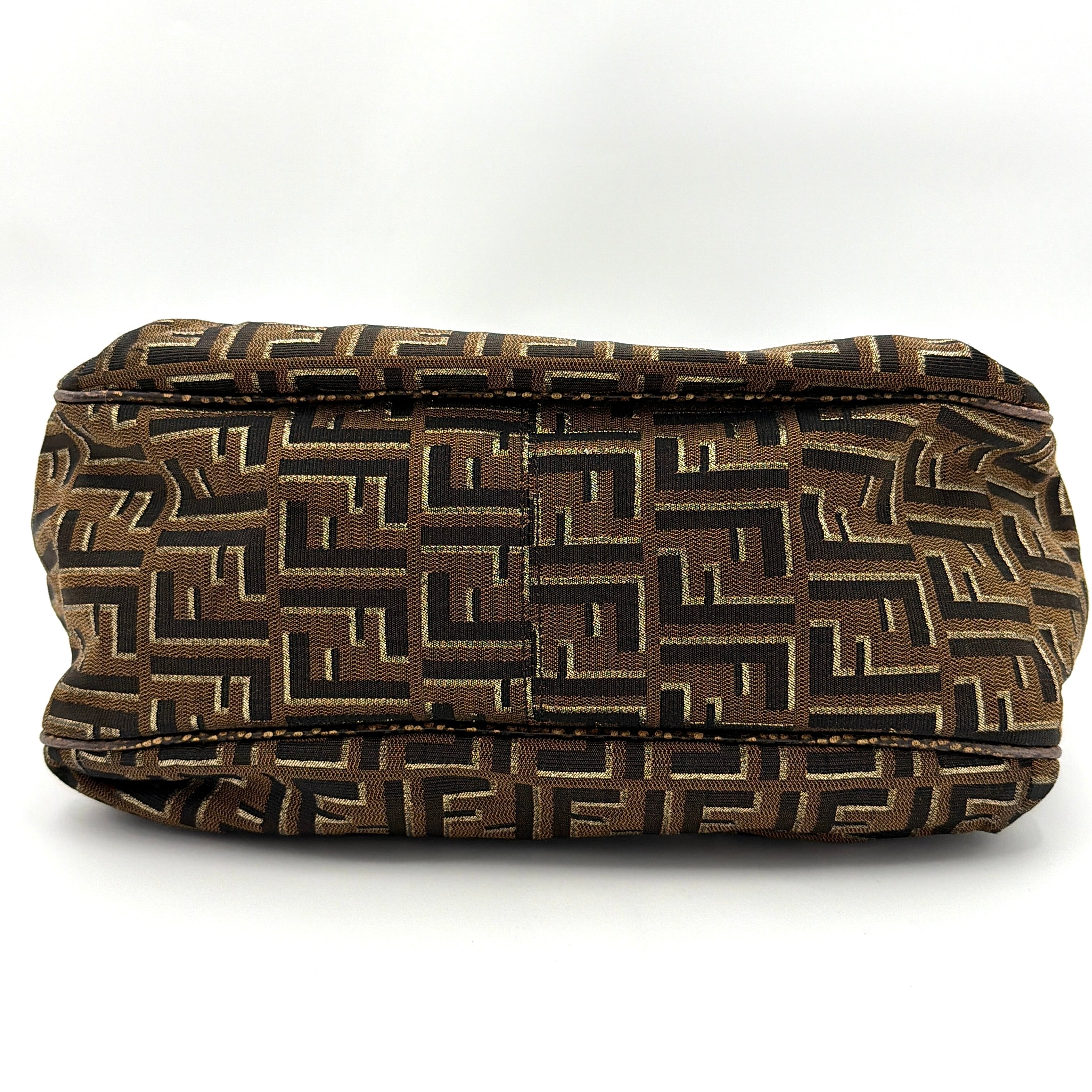 The Fendi FF Zucca Chef Shoulder Bag in brown jacquard canvas with all-over FF monogram, leather trim, and gold-tone ring handles.