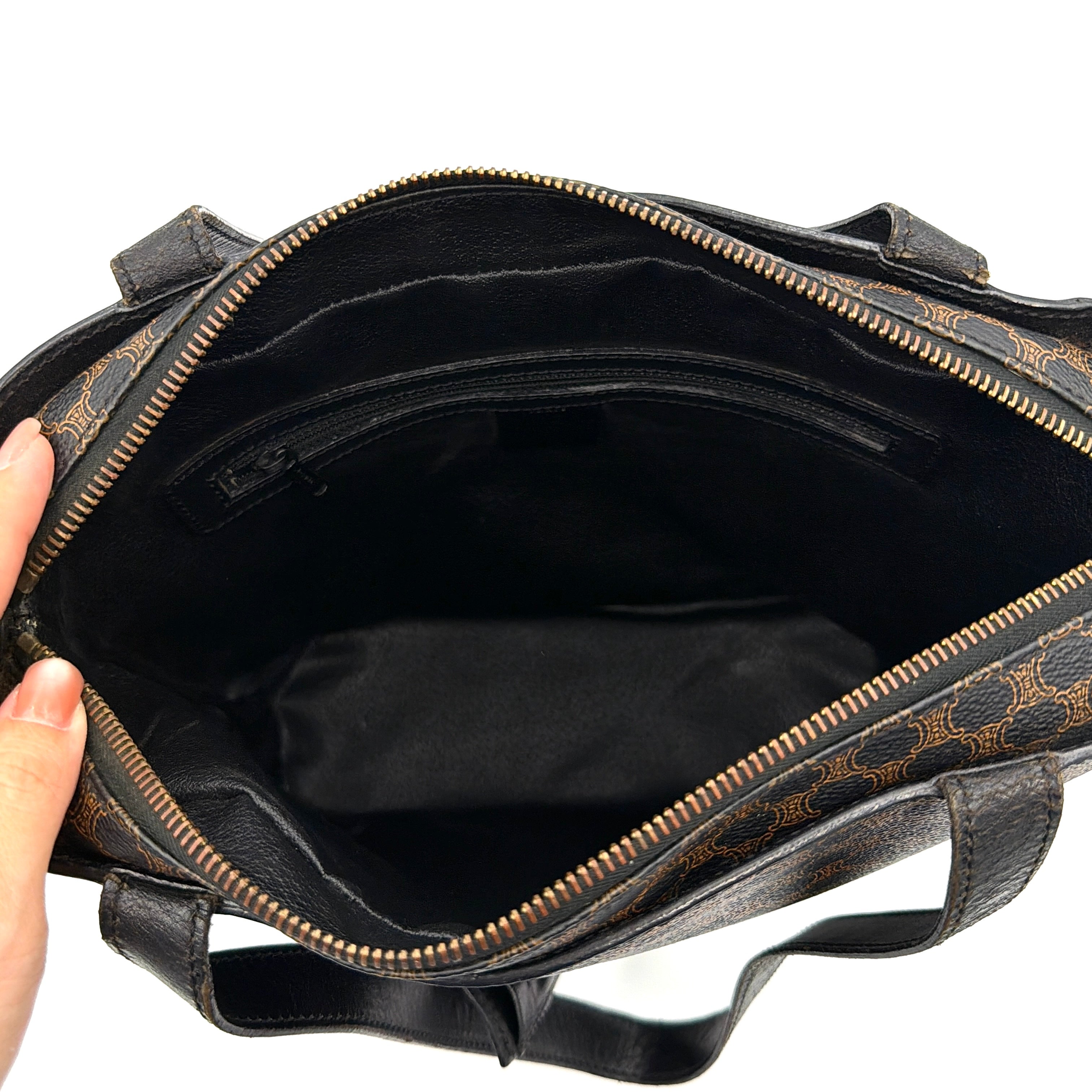 Celine Macadam Blason Tote Bag in brown coated canvas with all-over Macadam motif, black leather trim, and gold-tone Blason emblem front pocket.