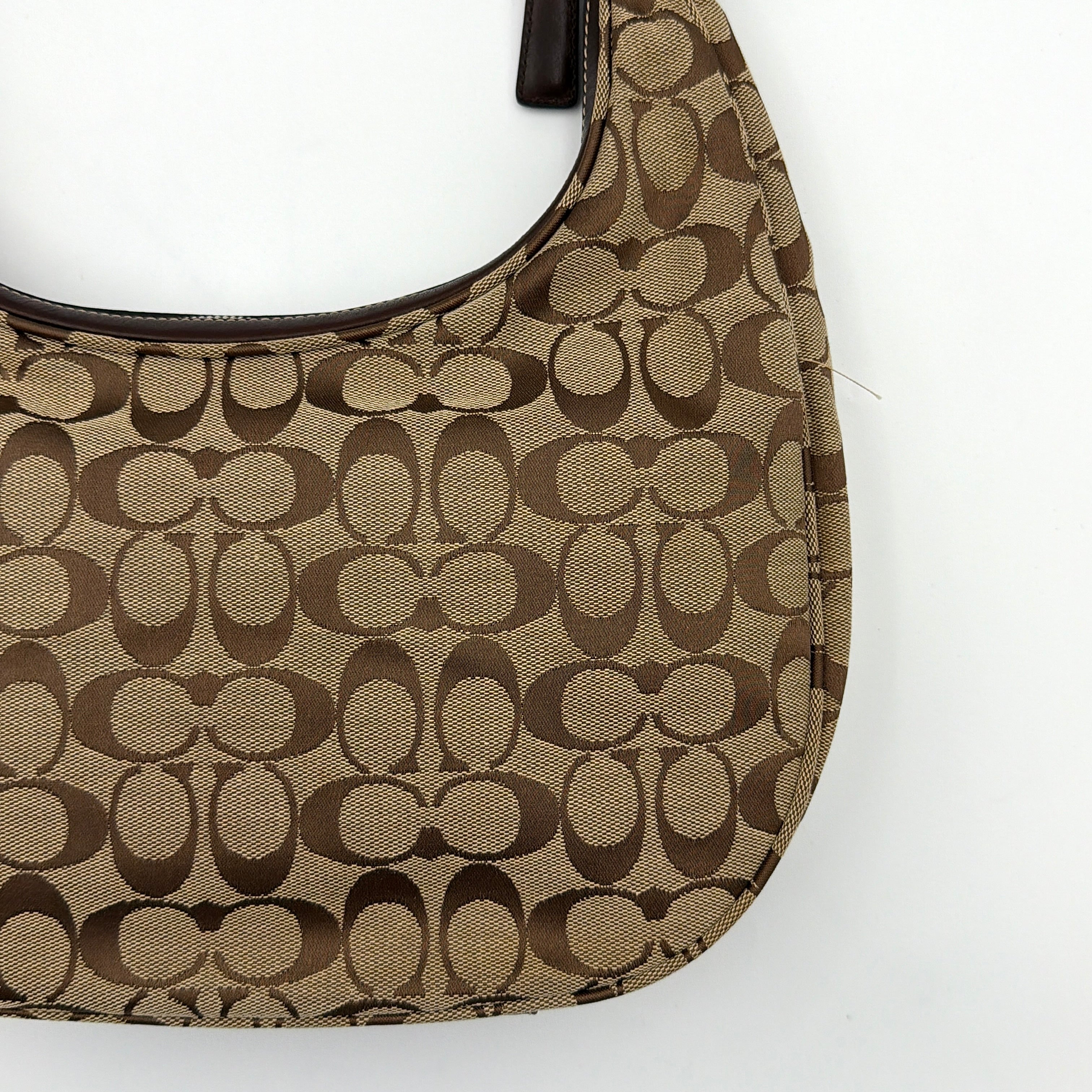Coach Signature Hamilton Hobo Shoulder Bag in beige and brown jacquard, showcasing the iconic 'C' monogram with leather trim and silver hardware.