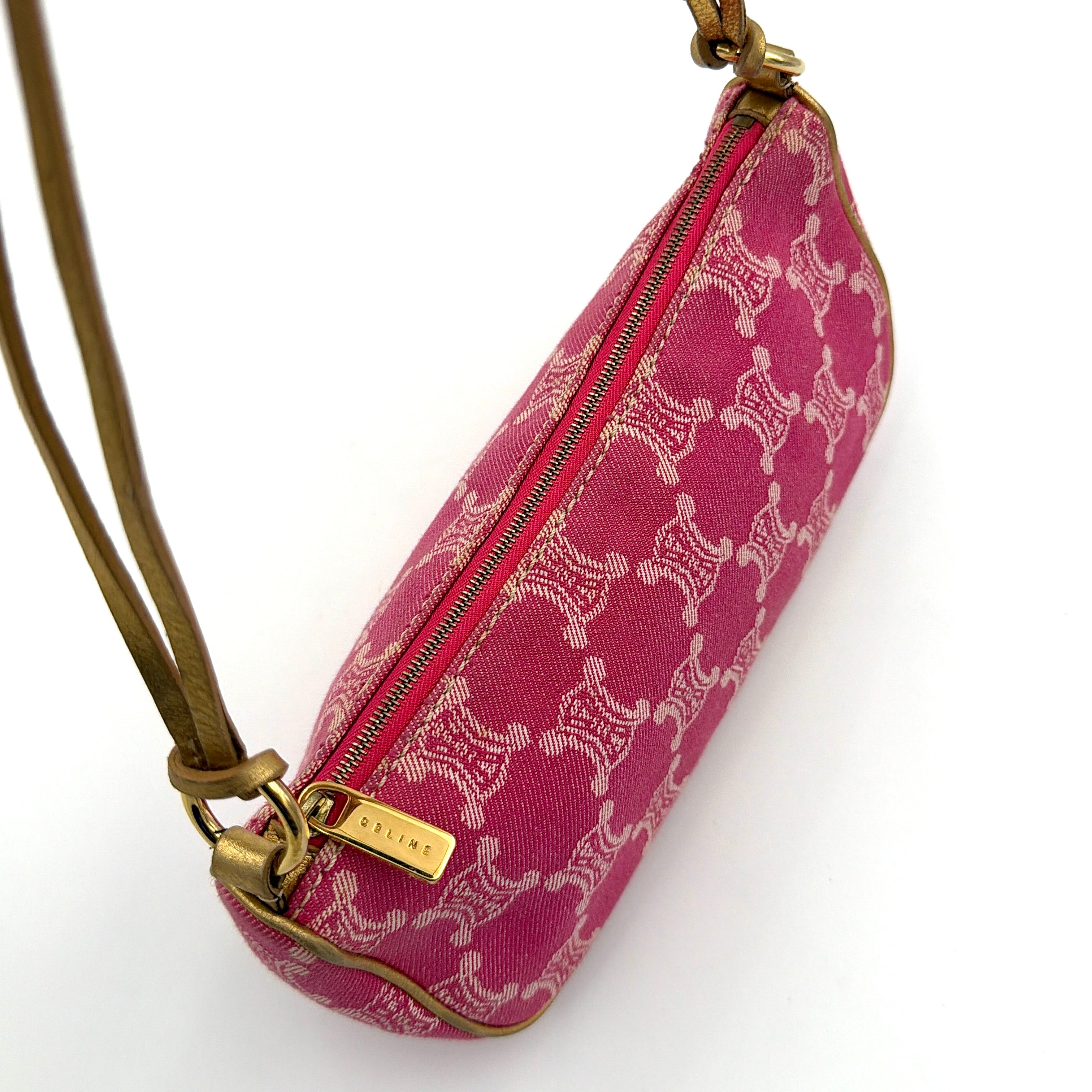 Front view of the Celine Macadam pink denim shoulder bag with gold-tone leather strap and triomphe monogram print.