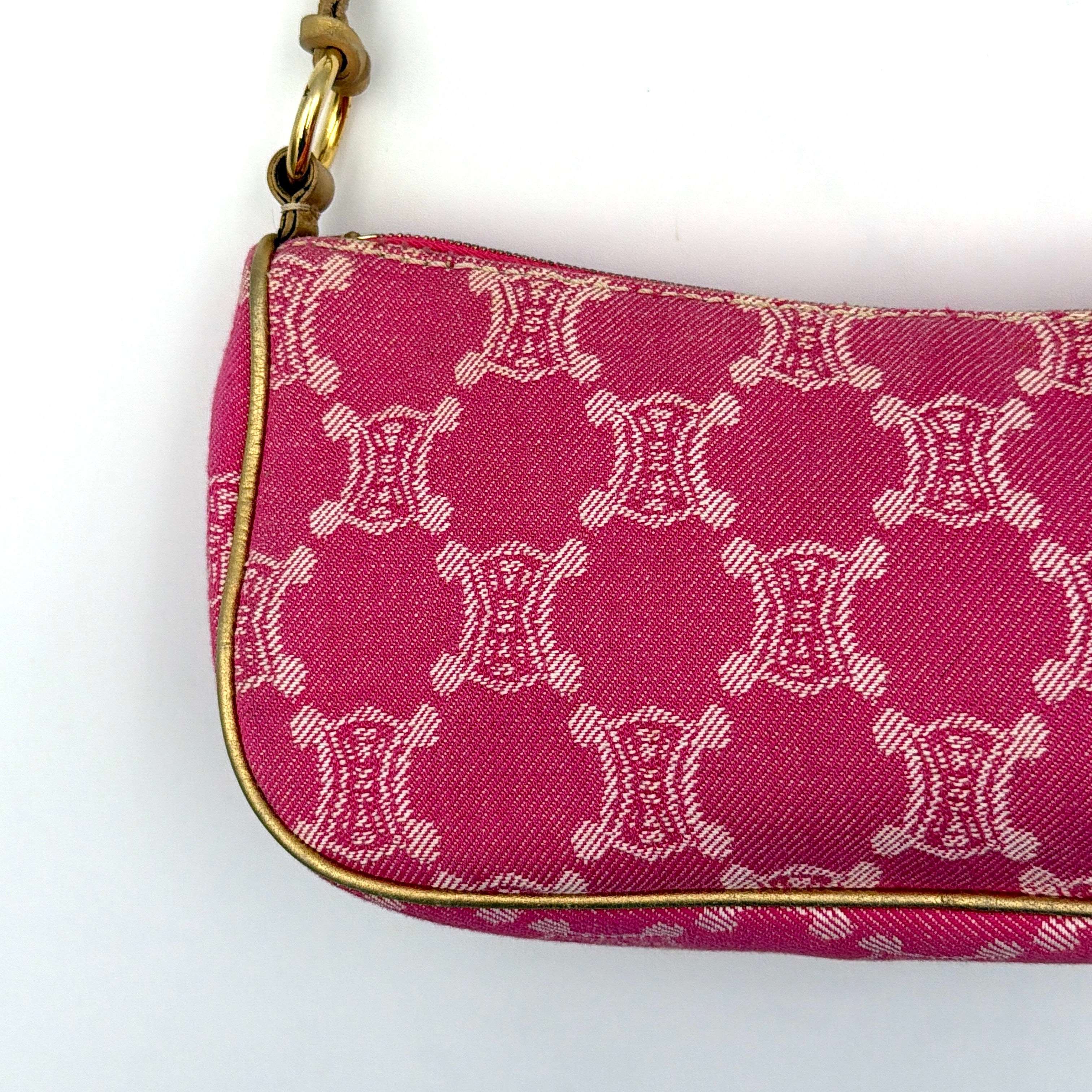 Front view of the Celine Macadam pink denim shoulder bag with gold-tone leather strap and triomphe monogram print.