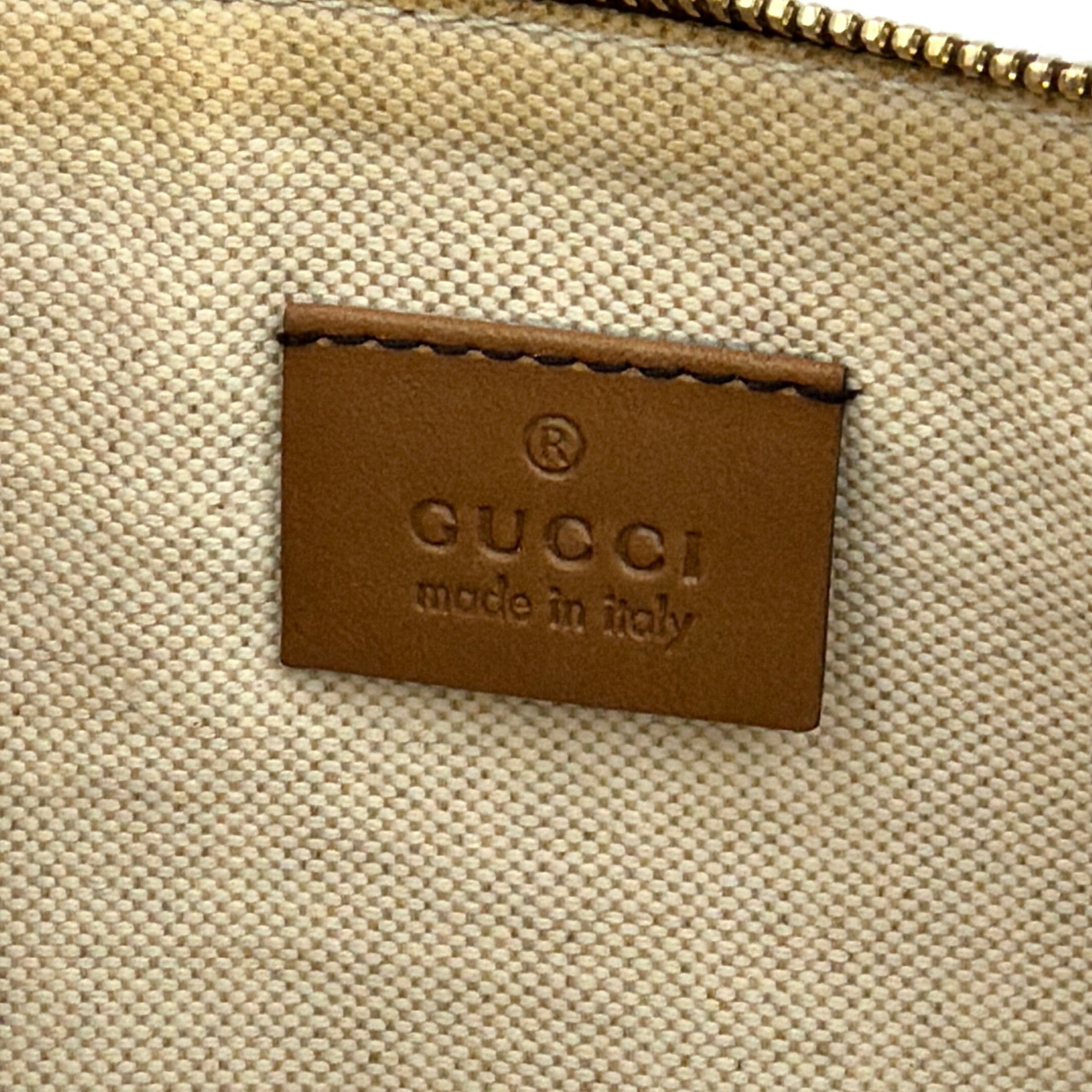 Gucci GG Monogram Craft Shoulder Bag in beige and brown canvas with double leather straps and matching logo-embossed leather pouch.