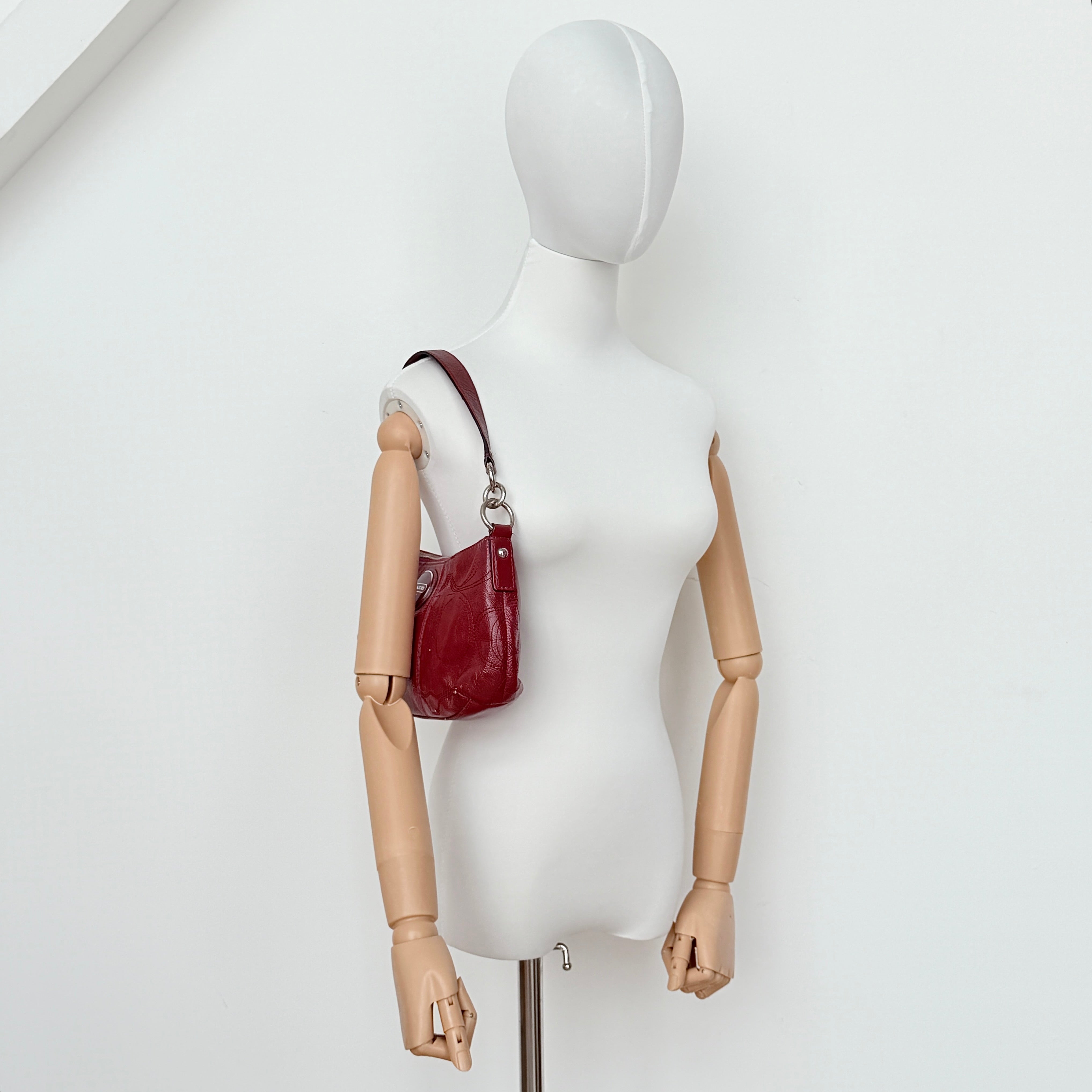 Coach 2Way Signature Stripe Shoulder Bag in red leather with detachable strap, shown against a white background.
