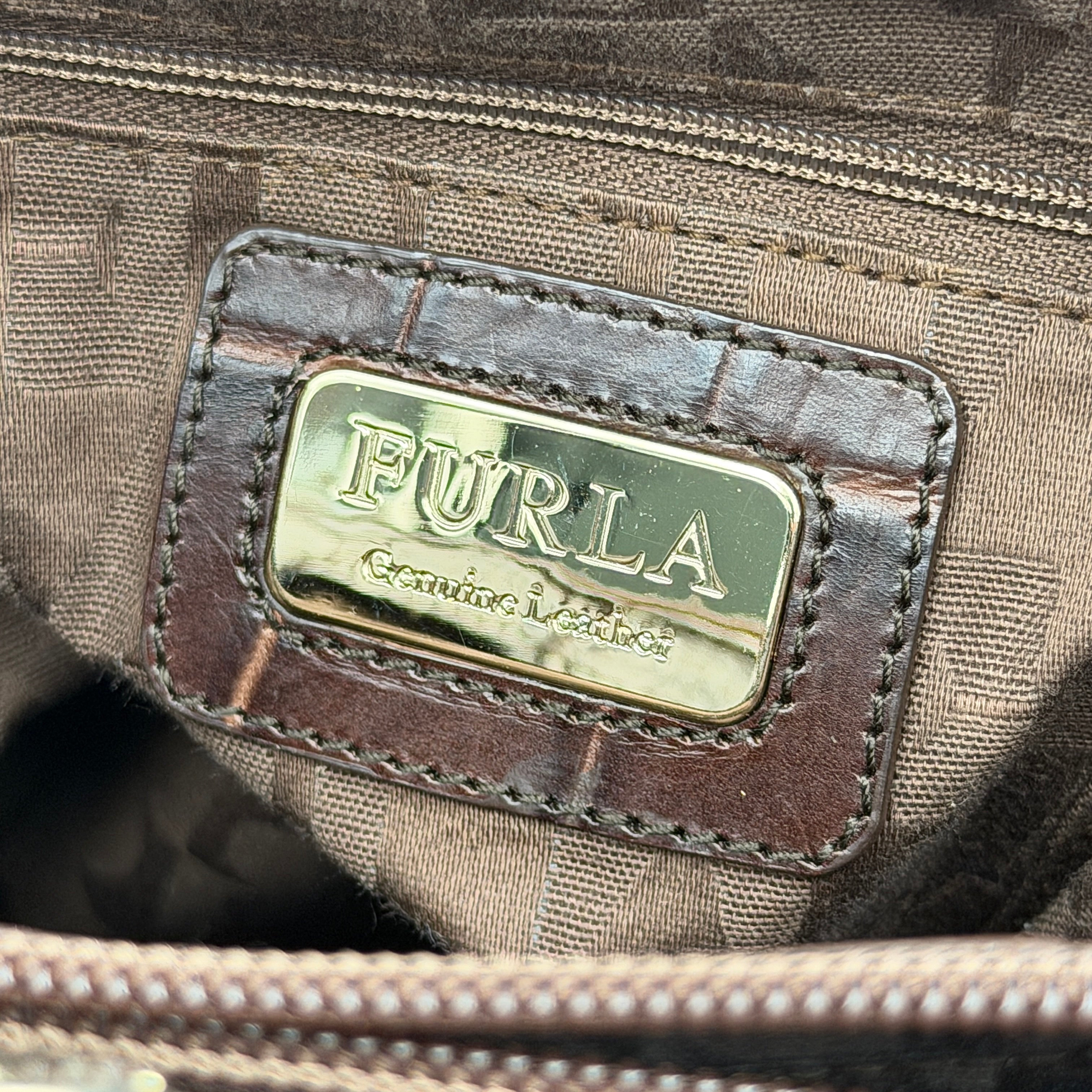 Furla dark brown croc-embossed leather tote bag with gold logo charm, structured silhouette, and double handles.