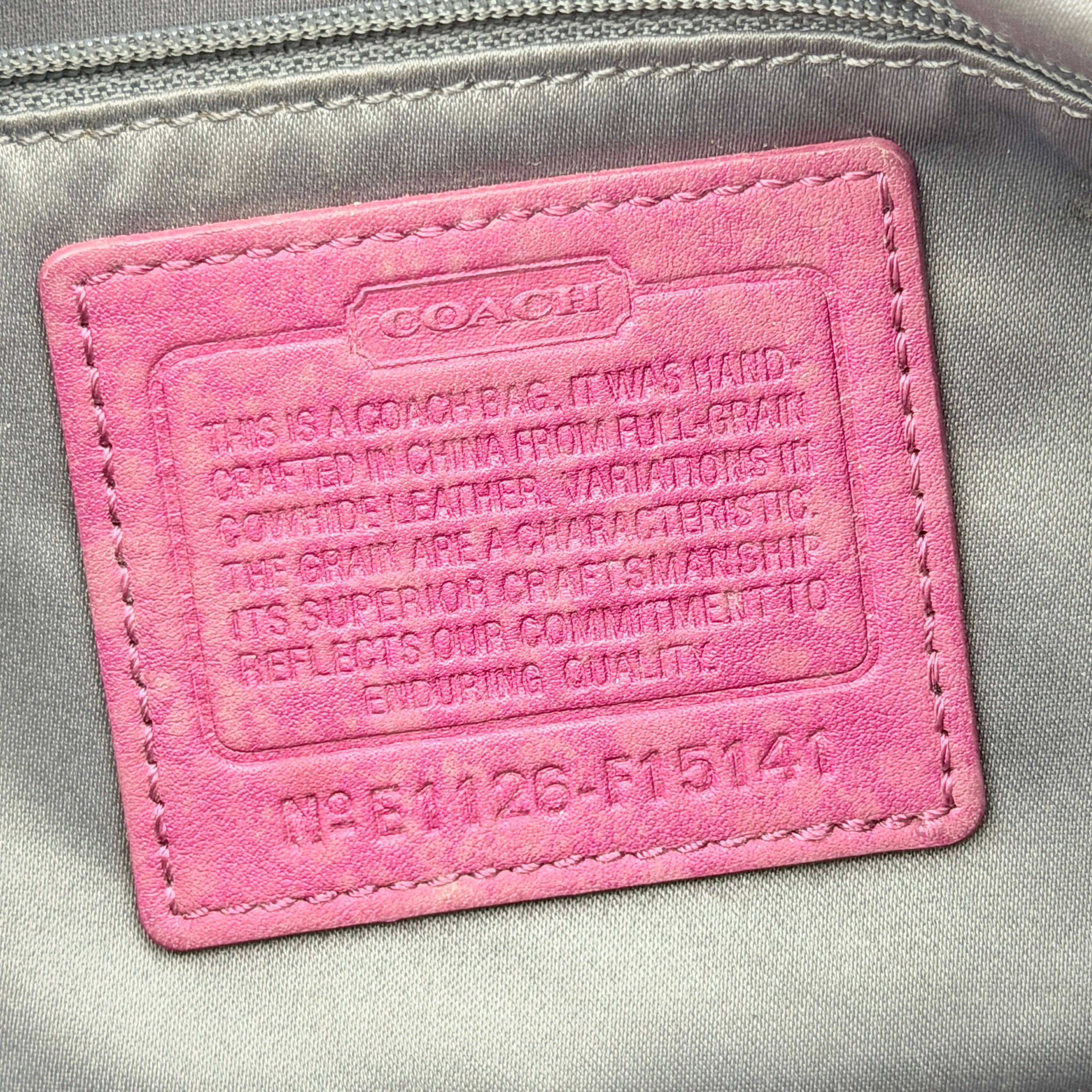 Coach 2Way Signature Stripe Shoulder Bag in red leather with detachable strap, shown against a white background.