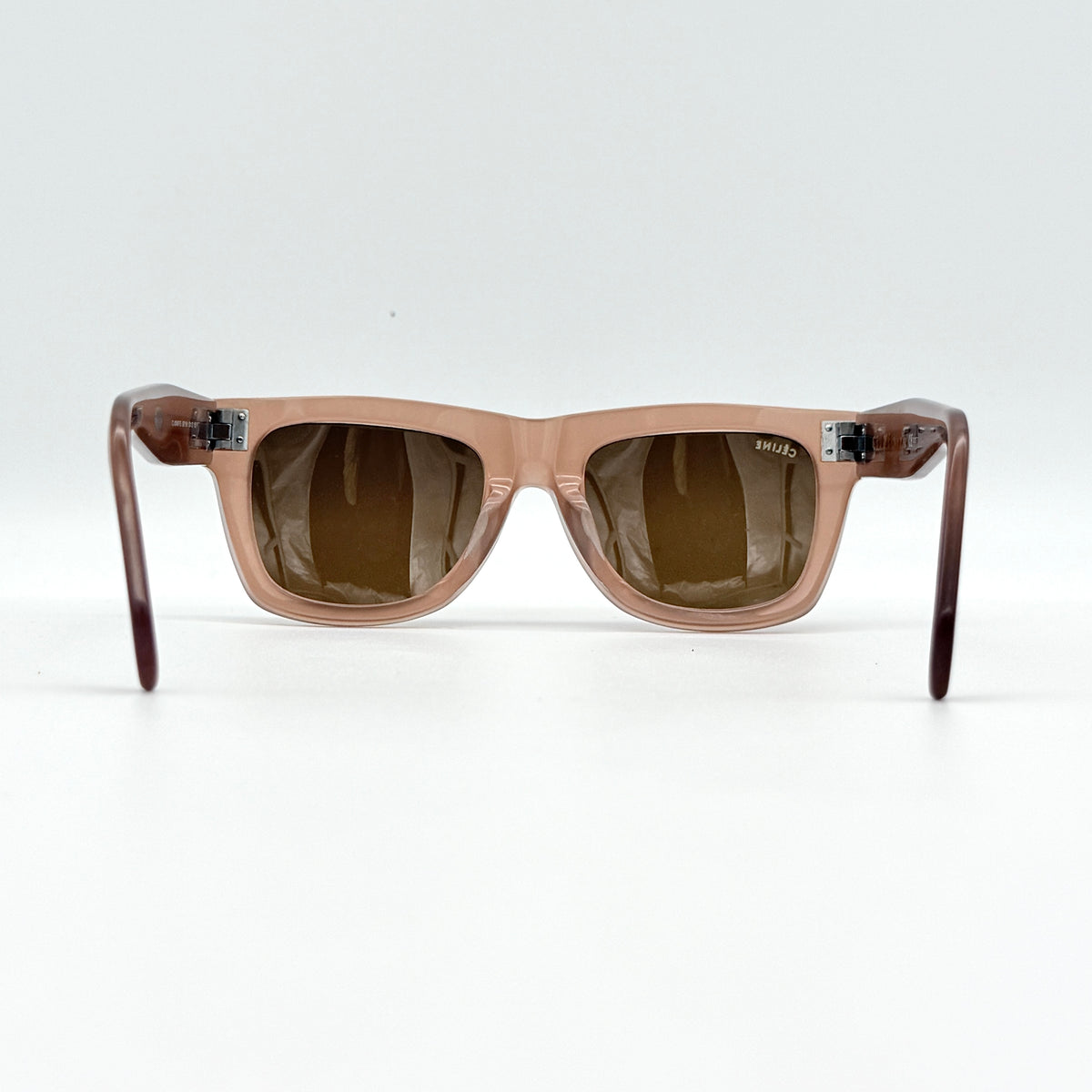 Celine CL 41046/F/S Tilda sunglasses in brown acetate with silver hardware, shown with Celine case and cloth.
