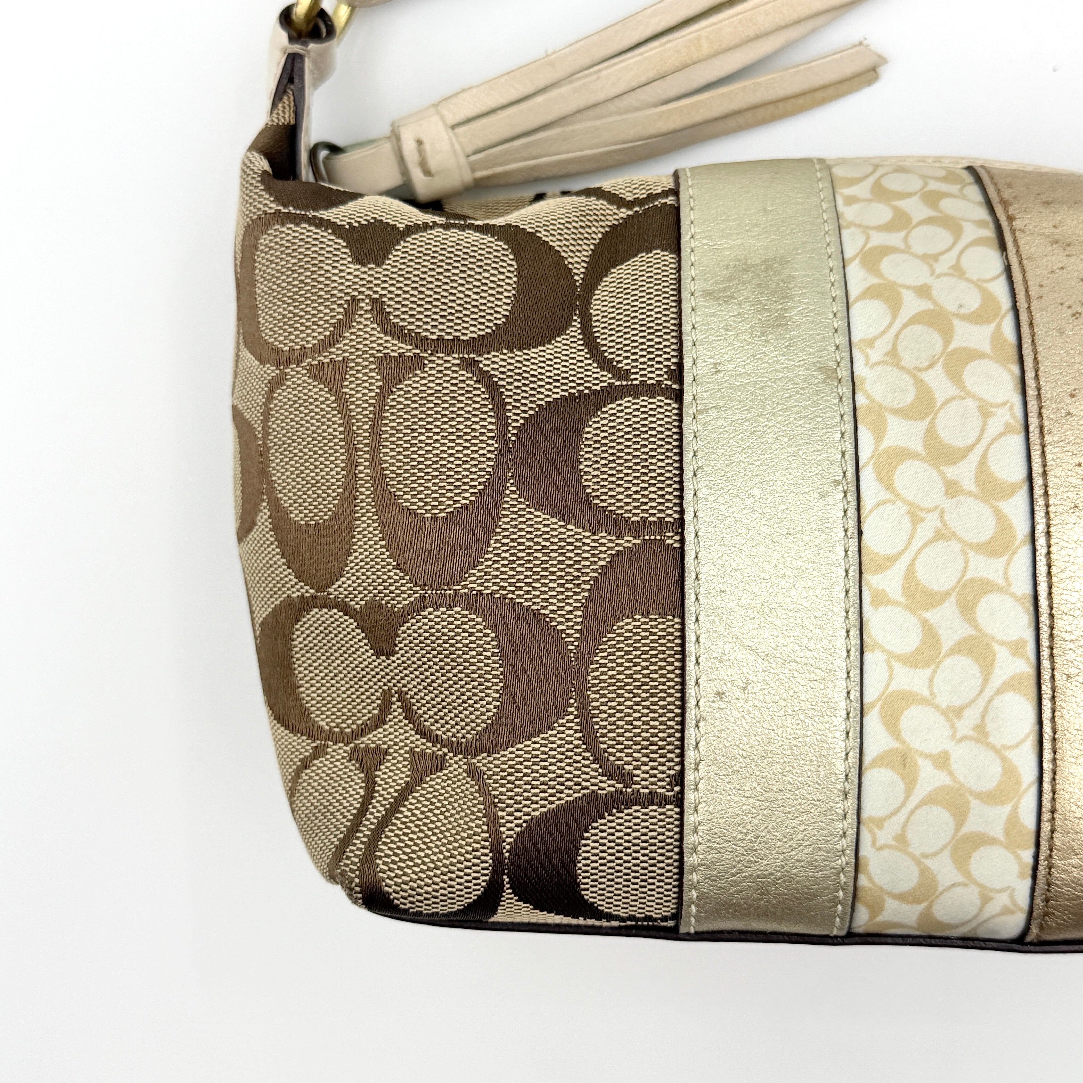 Coach Signature Stripe Mini Hobo Shoulder Bag in beige and gold with monogram canvas, cream leather trim, and gold stripes.