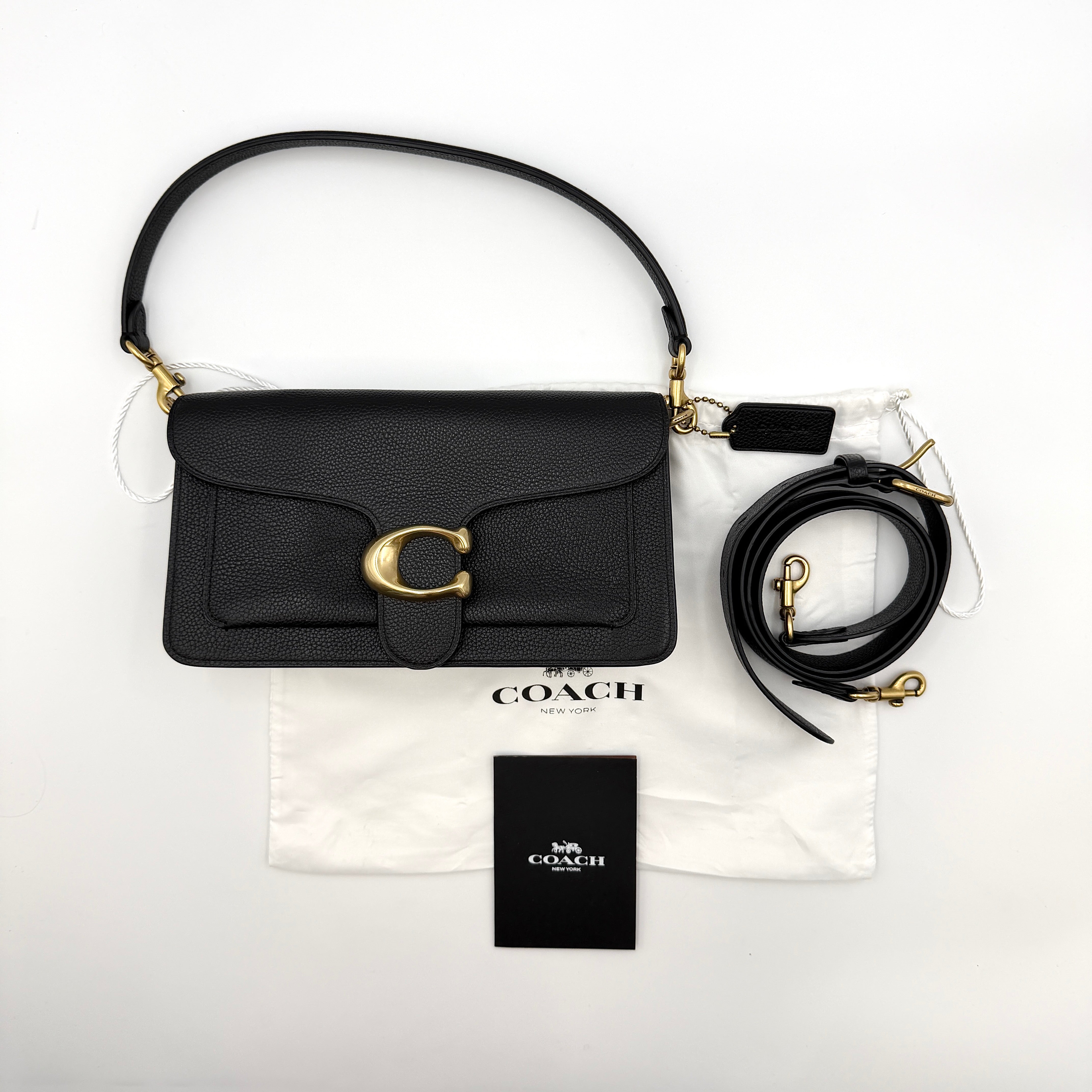 Coach Tabby 26 black shoulder bag with gold hardware and detachable straps, shown with dust bag and care card.