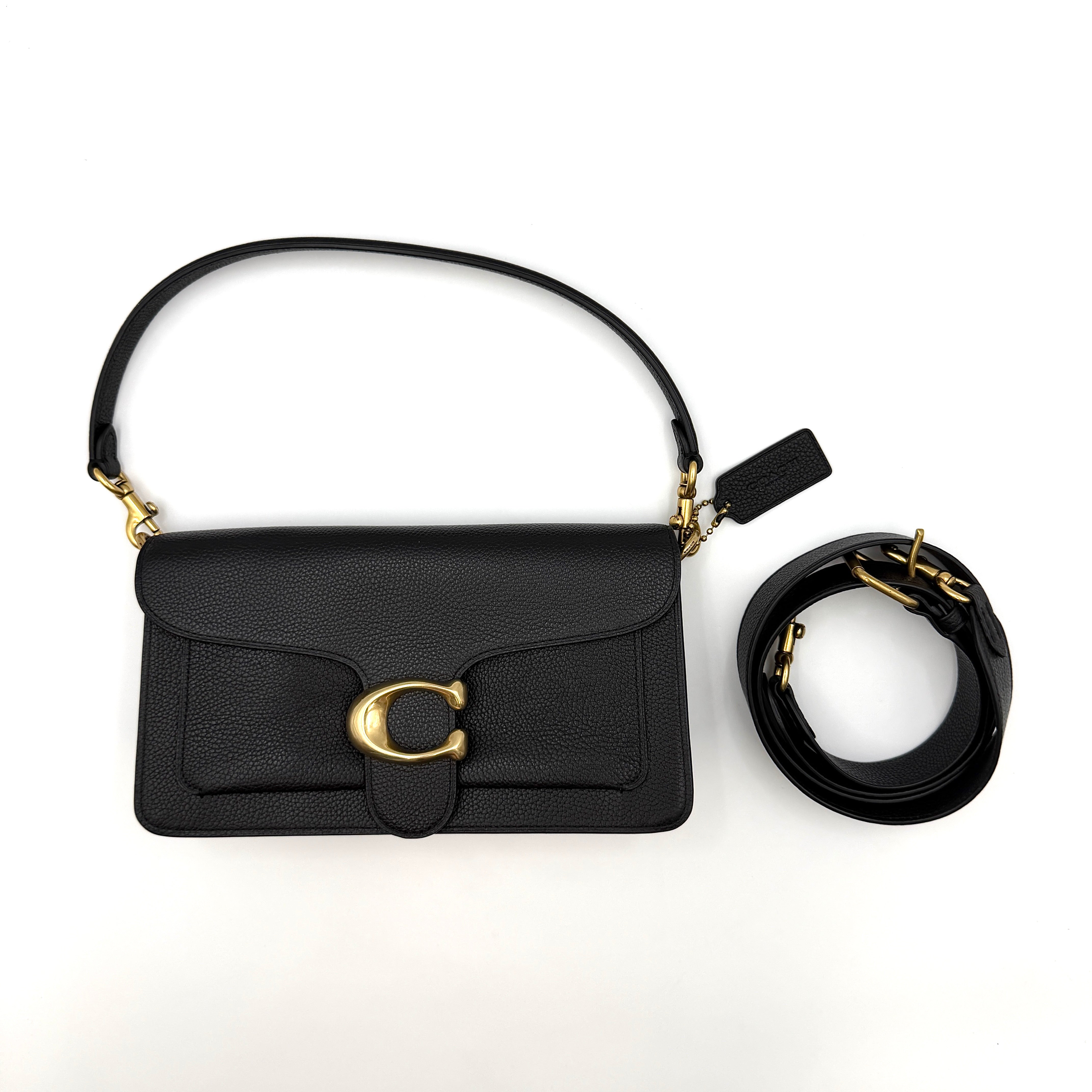 Coach Tabby 26 black shoulder bag with gold hardware and detachable straps, shown with dust bag and care card.