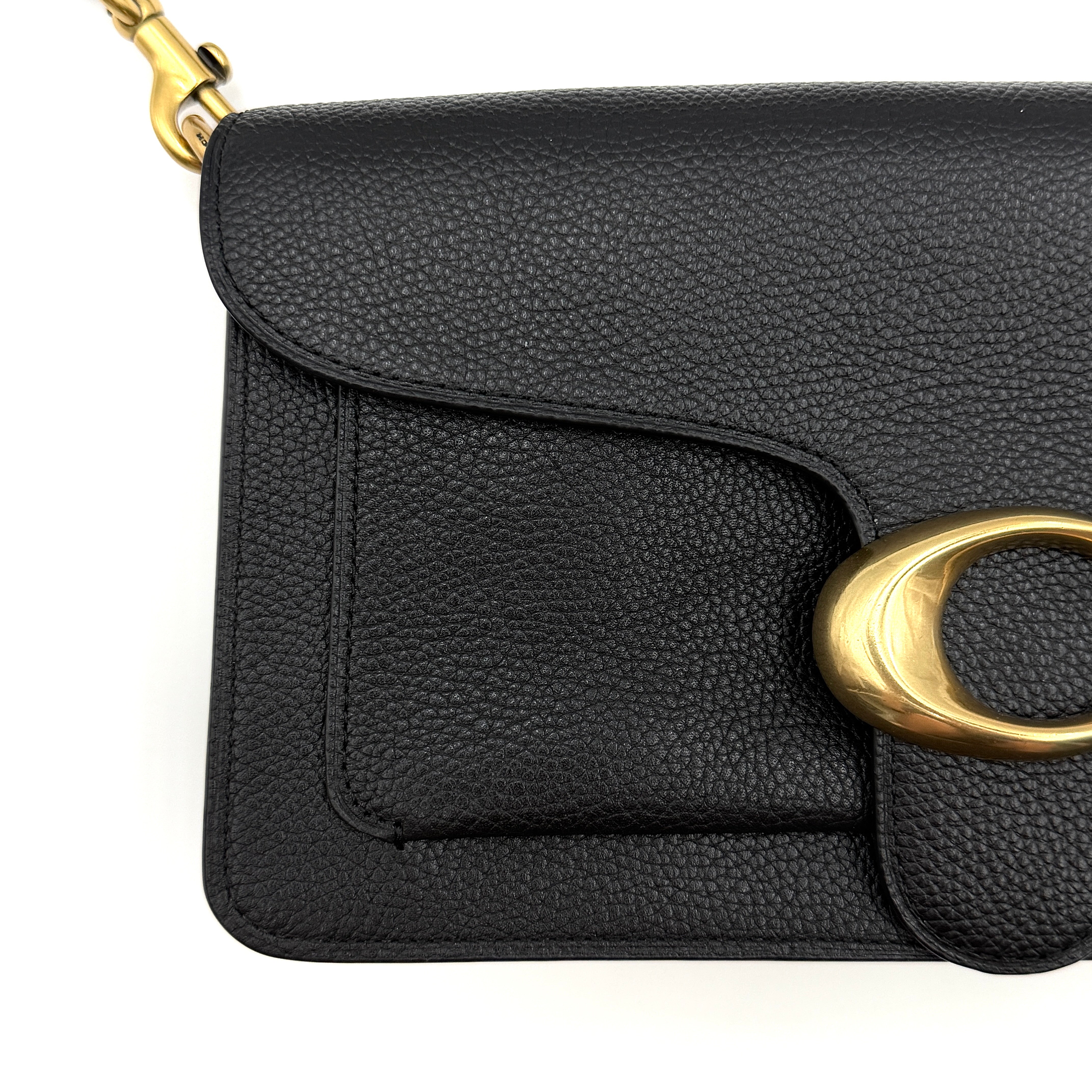 Coach Tabby 26 black shoulder bag with gold hardware and detachable straps, shown with dust bag and care card.