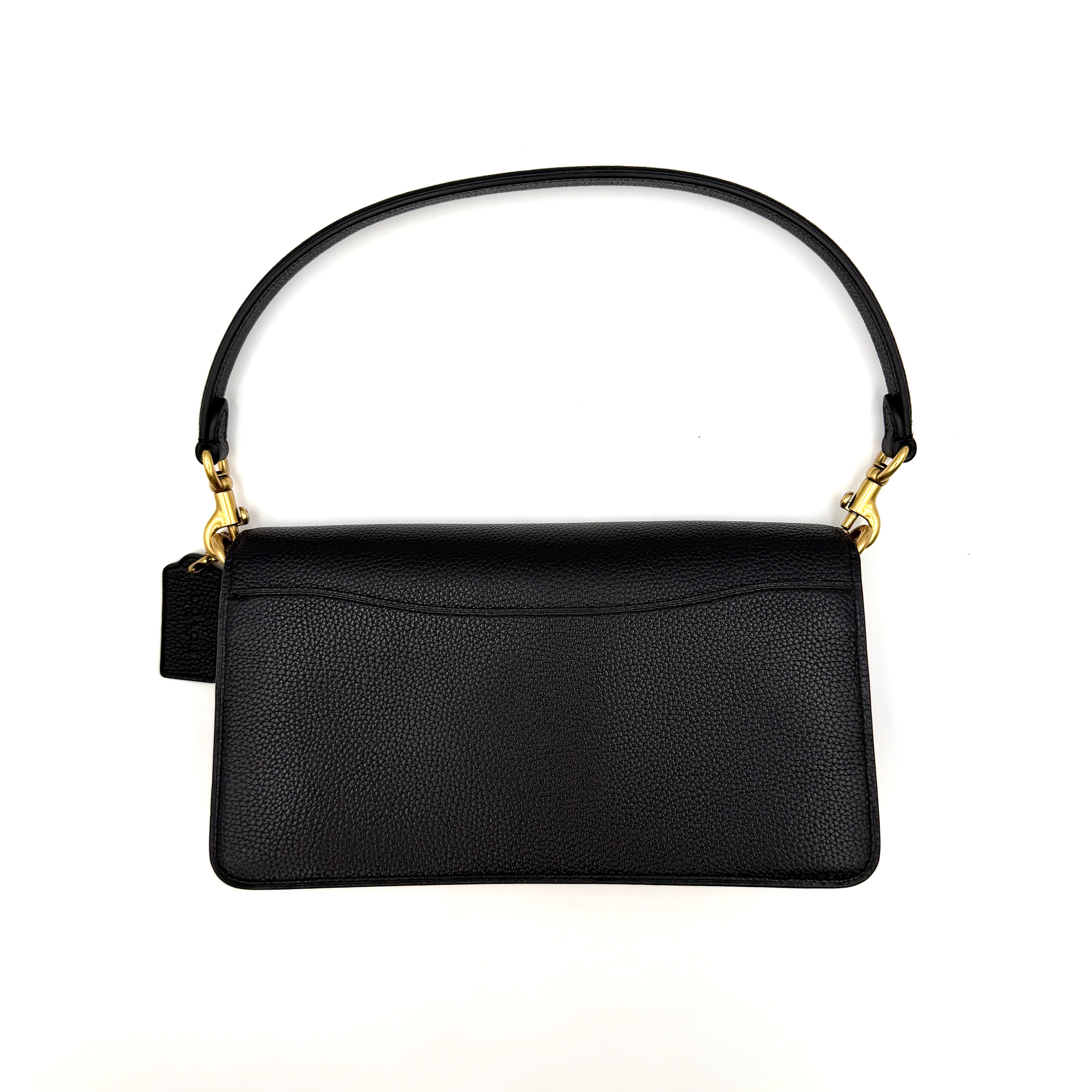 Coach Tabby 26 black shoulder bag with gold hardware and detachable straps, shown with dust bag and care card.