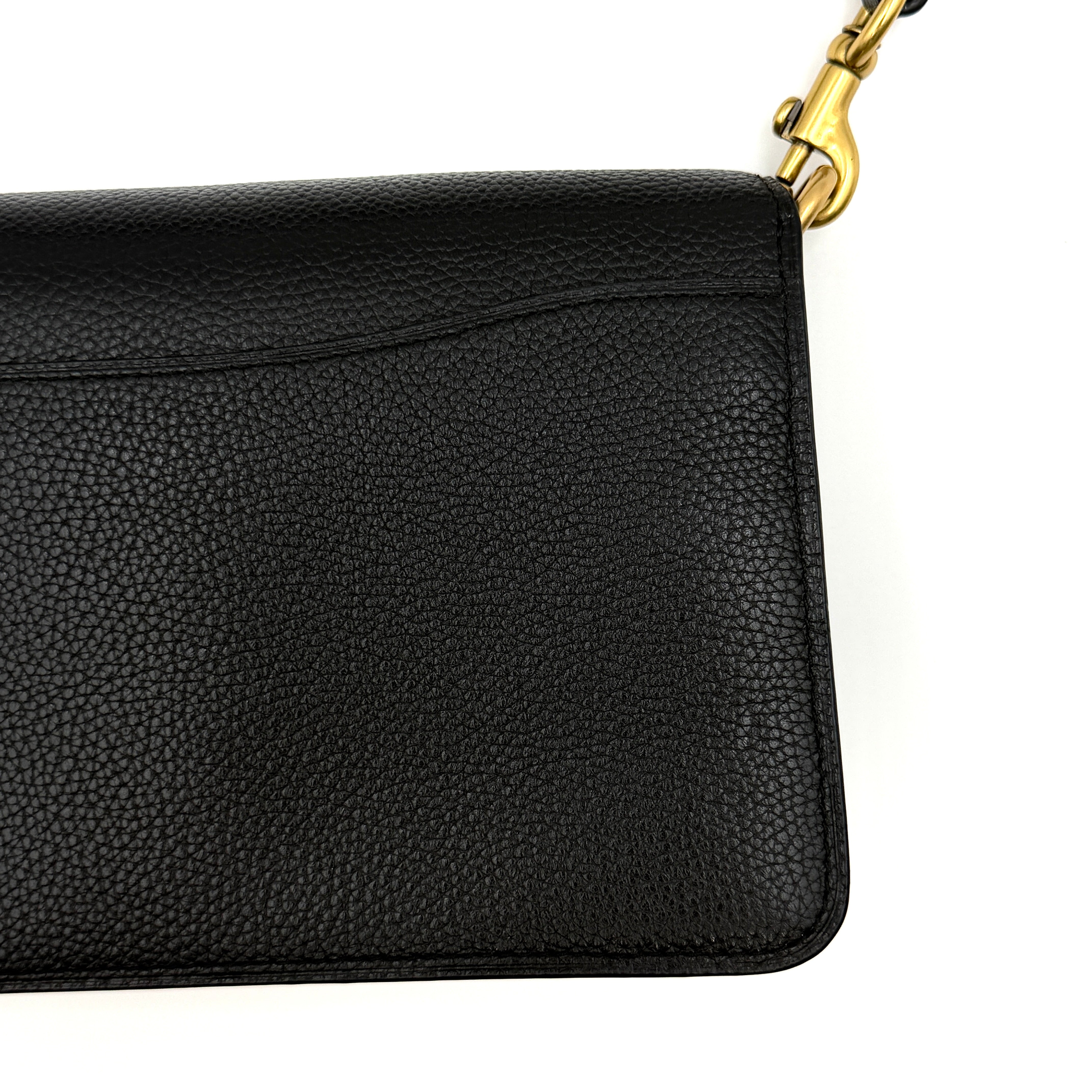 Coach Tabby 26 black shoulder bag with gold hardware and detachable straps, shown with dust bag and care card.