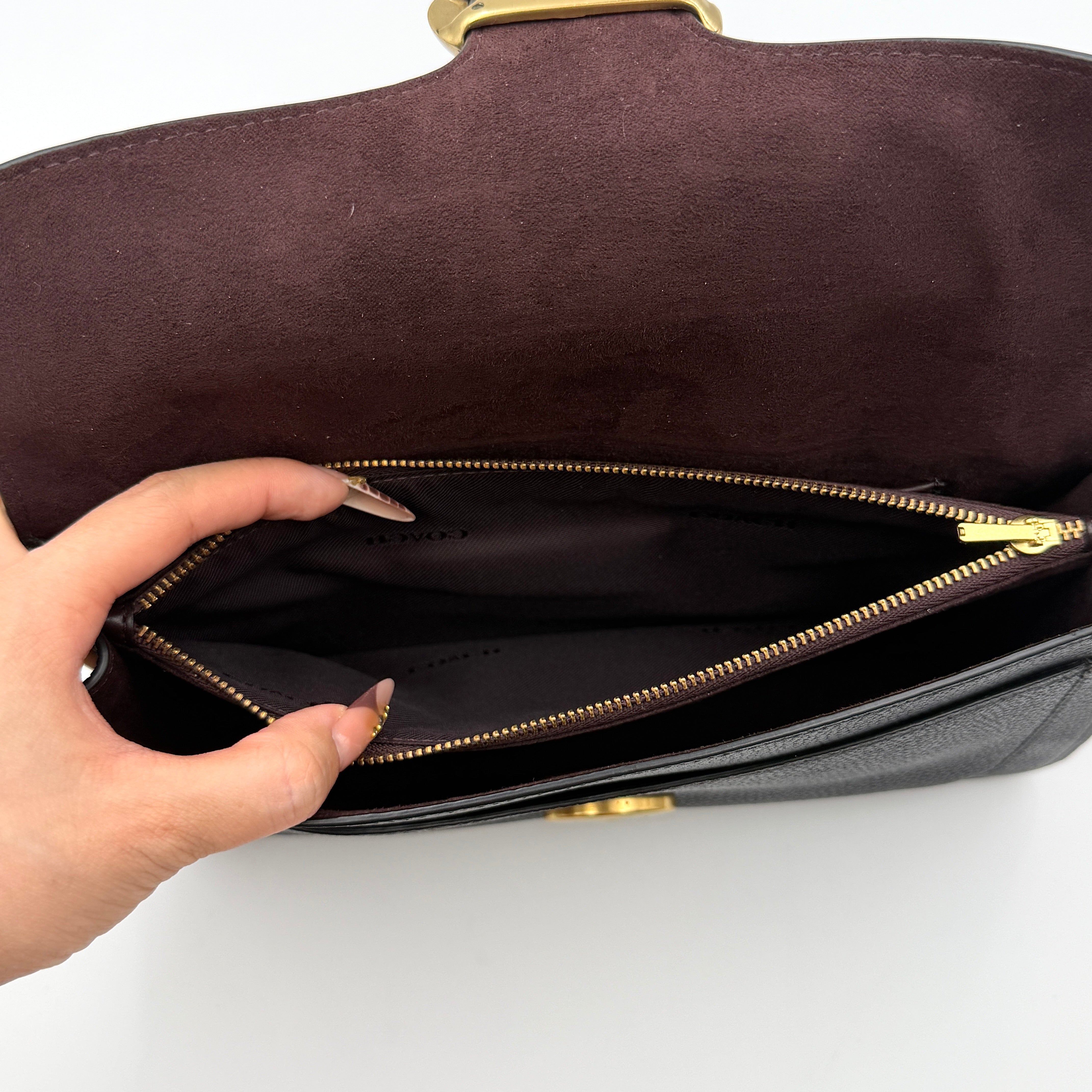 Coach Tabby 26 black shoulder bag with gold hardware and detachable straps, shown with dust bag and care card.