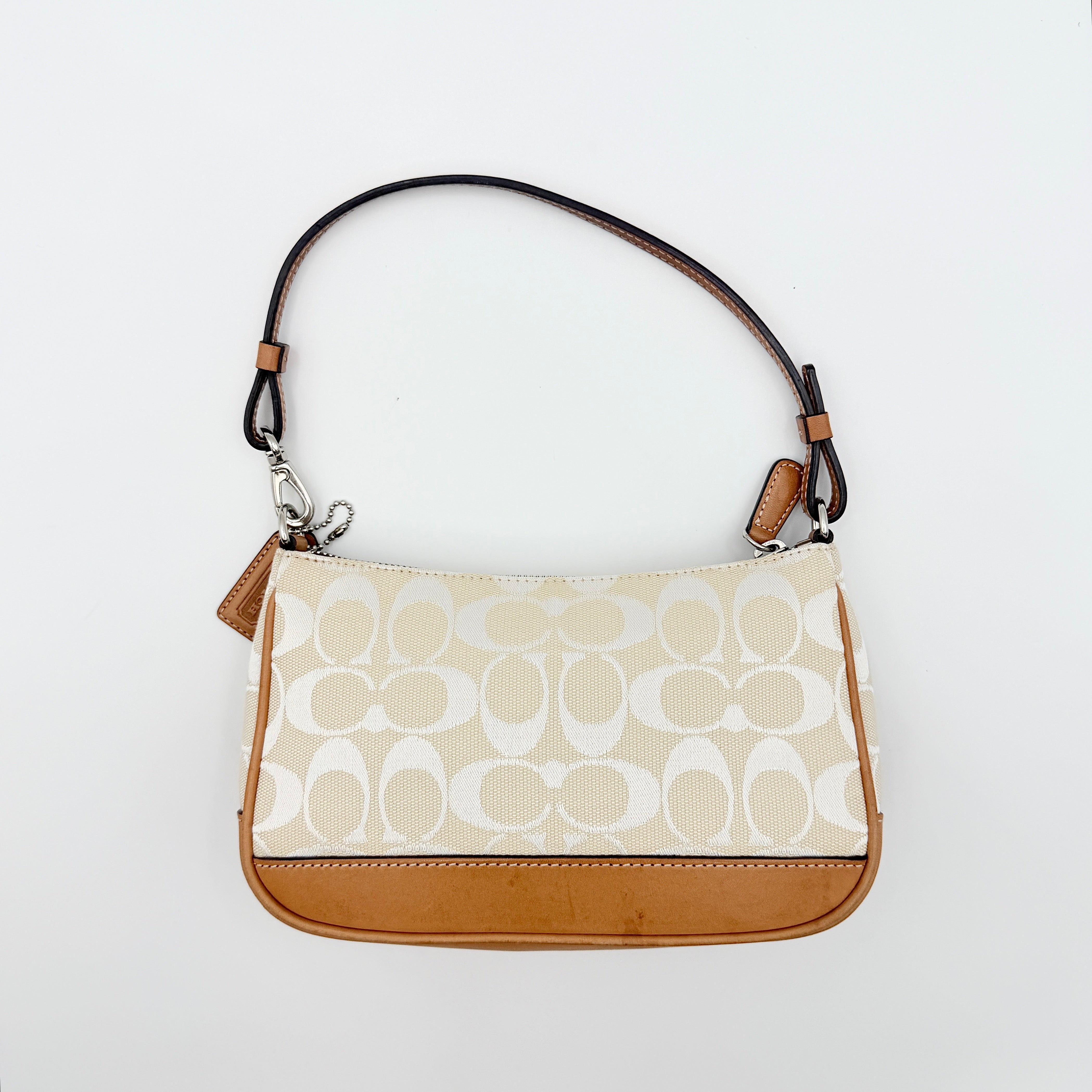 Coach Y2K Demi Shoulder Bag in cream and tan jacquard canvas with leather trim and signature tag.