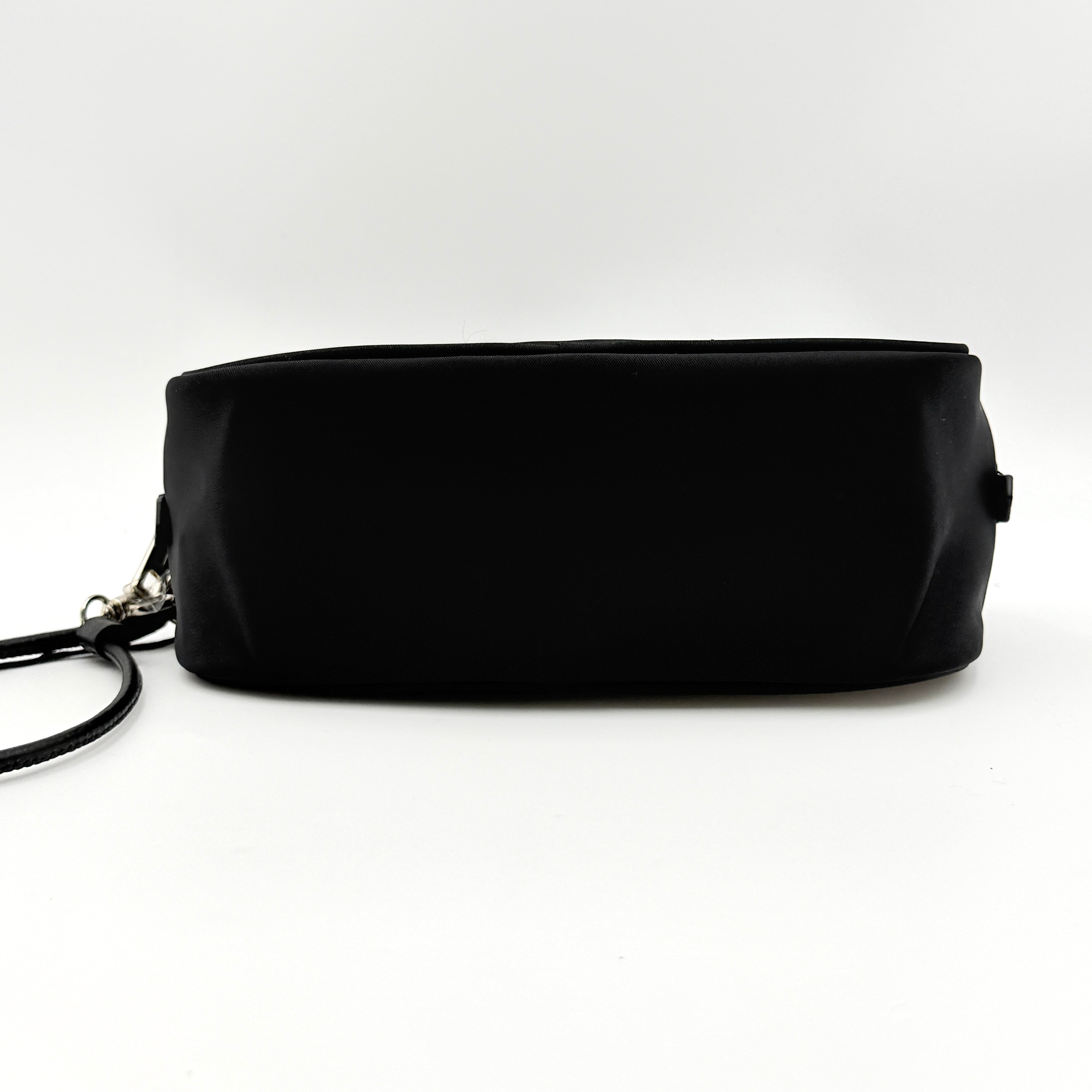 Furla Camelia Cosmetic Case in black nylon with gold logo and wristlet strap, shown with original tag.
