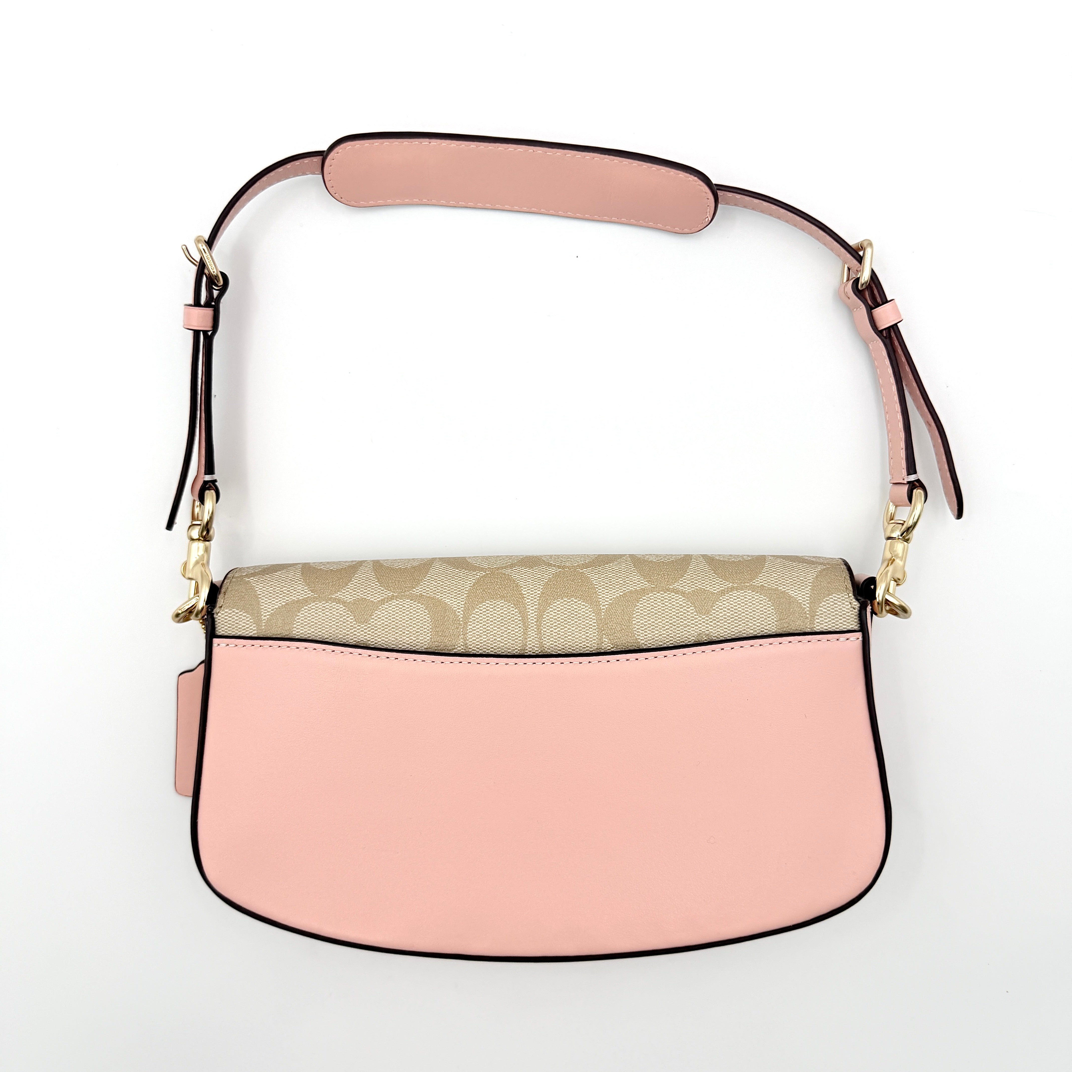 Coach X Observed By Us Andrea Shoulder Bag in beige monogram canvas with pink illustrations and pink leather strap.