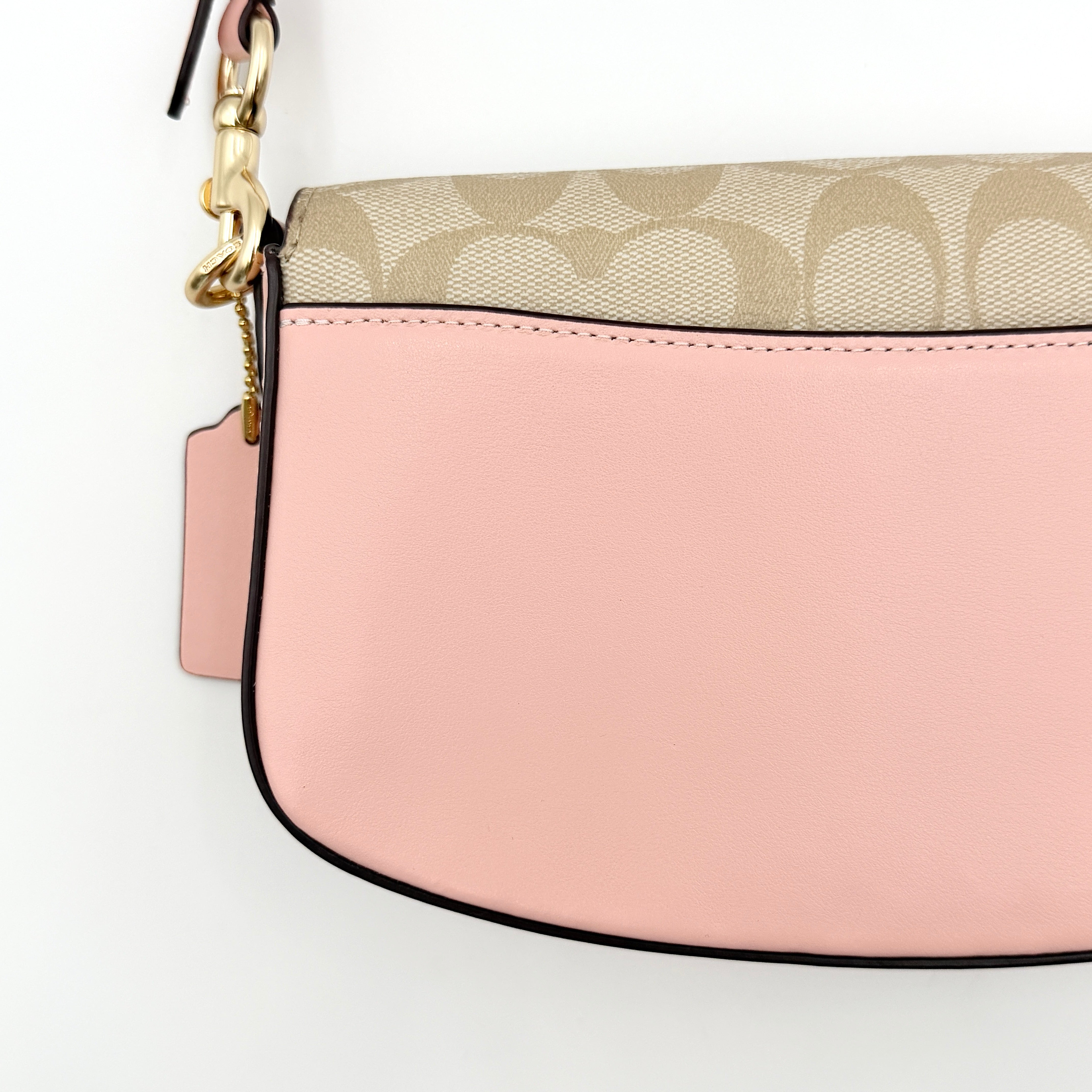 Coach X Observed By Us Andrea Shoulder Bag in beige monogram canvas with pink illustrations and pink leather strap.
