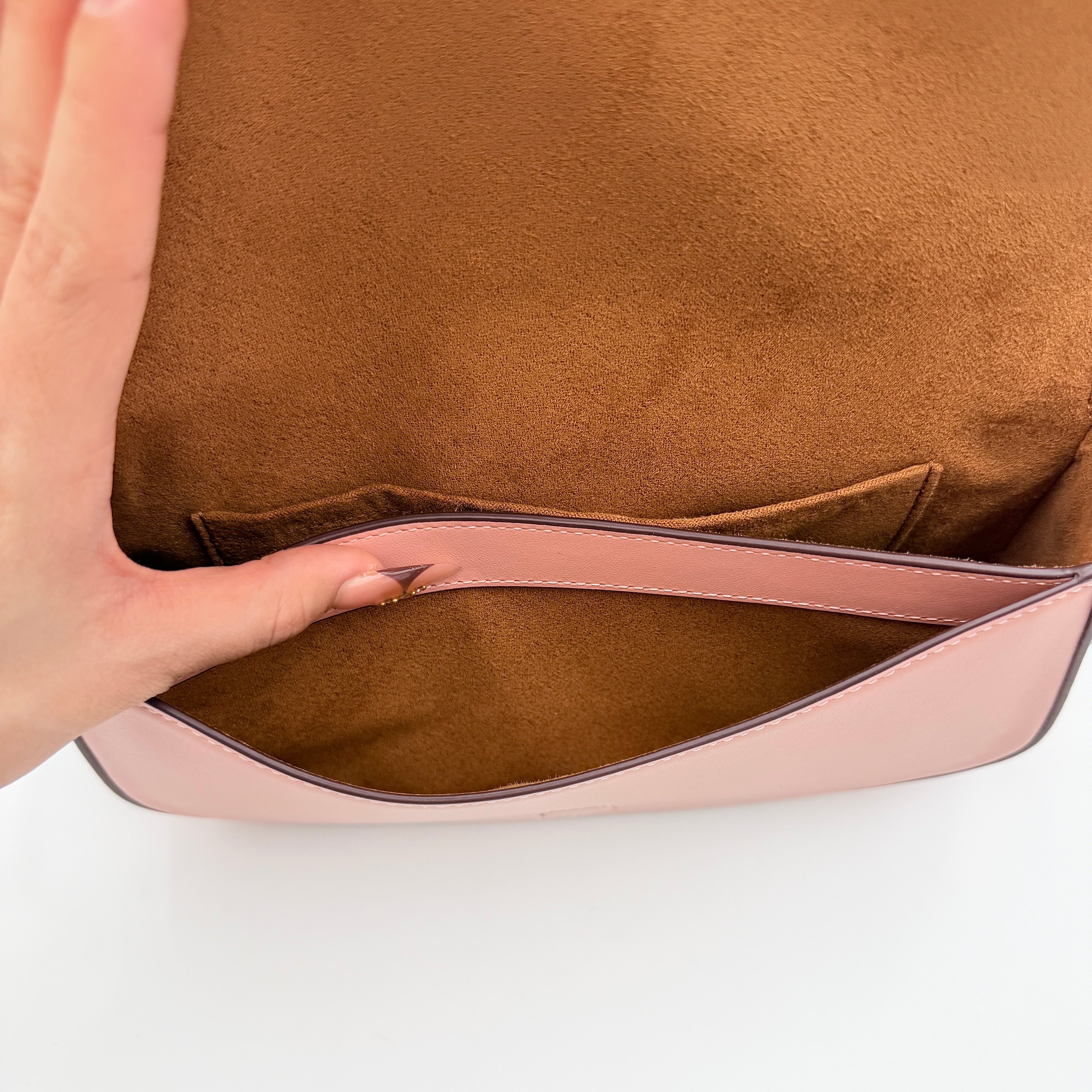 Coach X Observed By Us Andrea Shoulder Bag in beige monogram canvas with pink illustrations and pink leather strap.