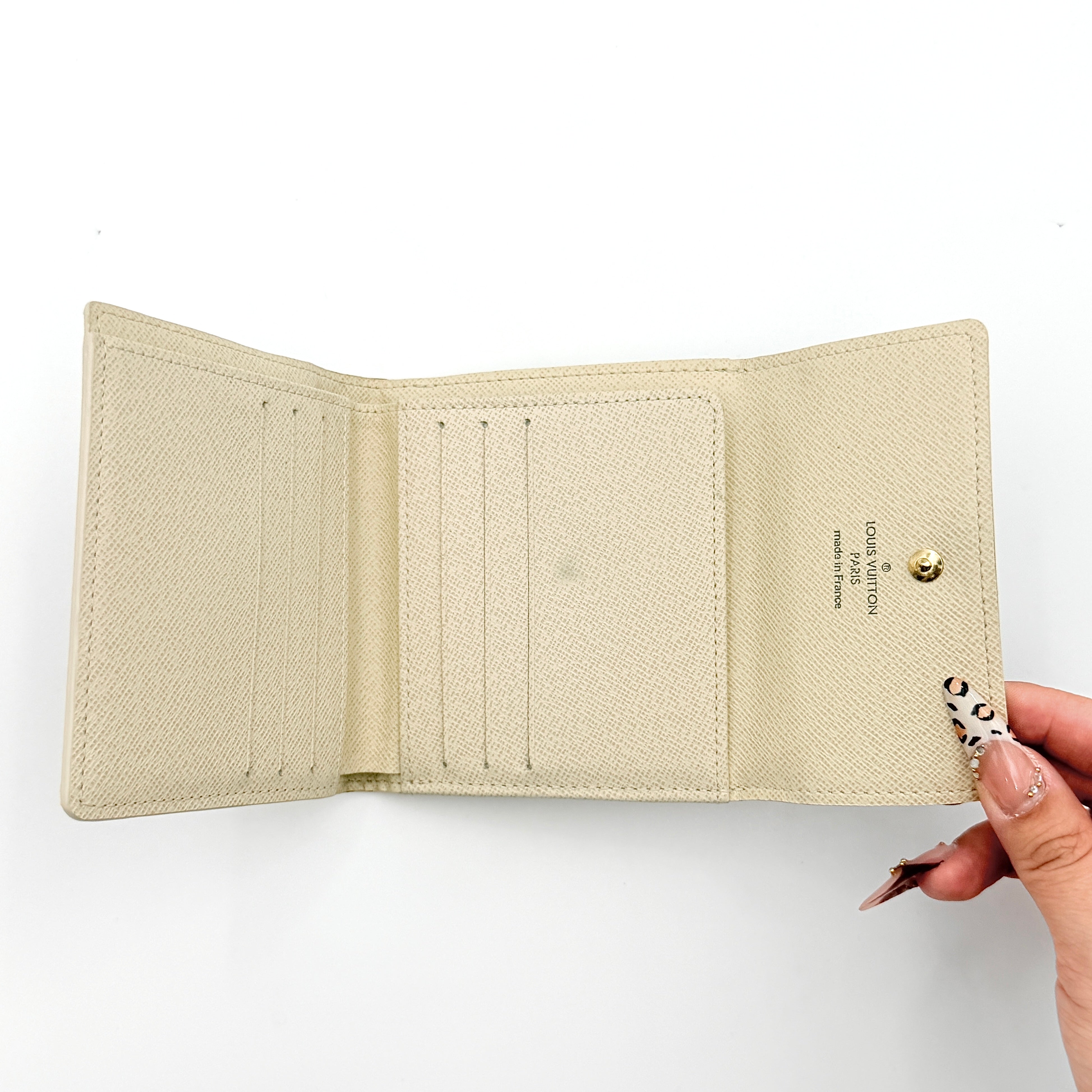 Louis Vuitton Damier Azur Elise Wallet in checked canvas with gold button snap, photographed on a clean white background.