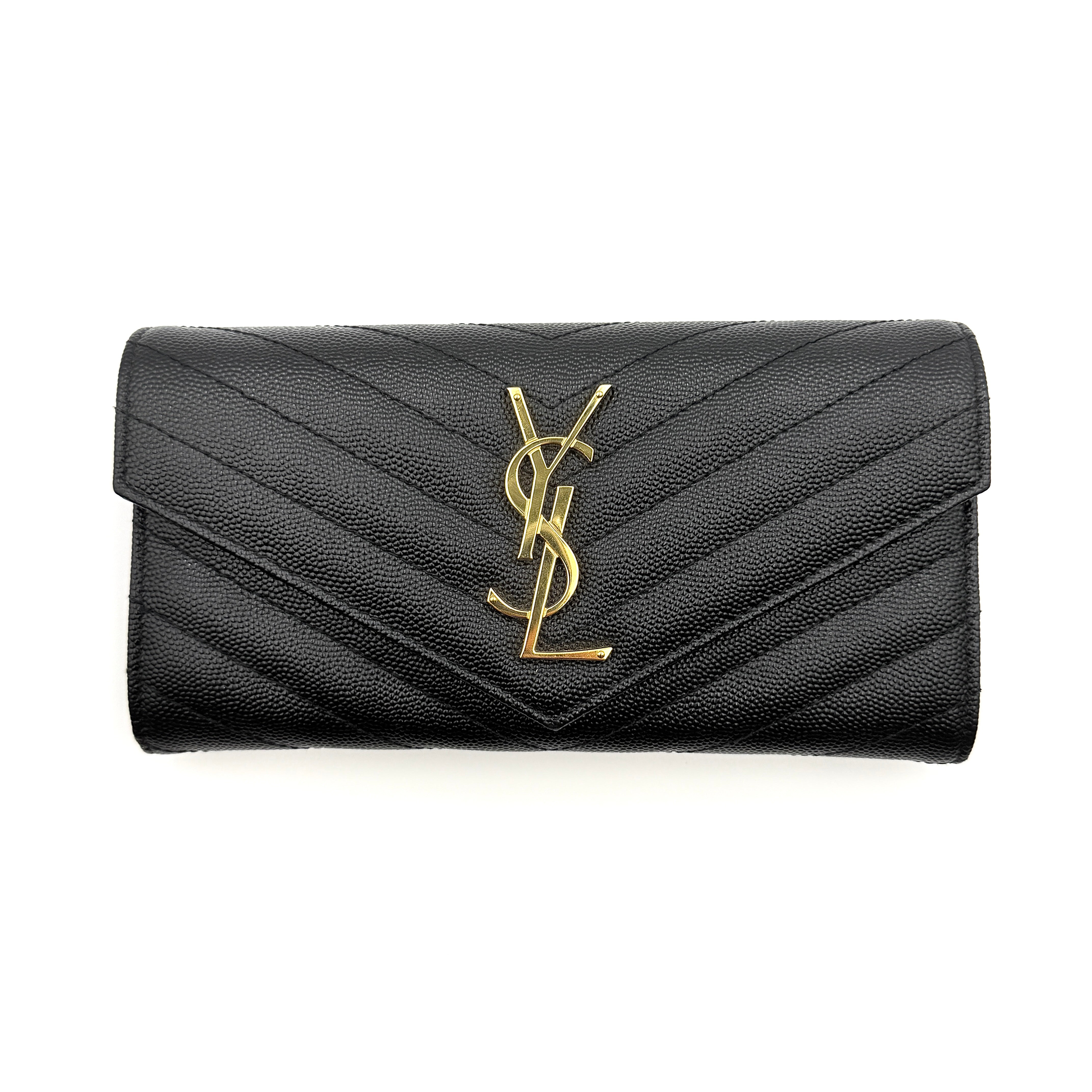 Saint Laurent Cassandre Large Flap Wallet in black grained leather with gold YSL monogram and chevron quilting.