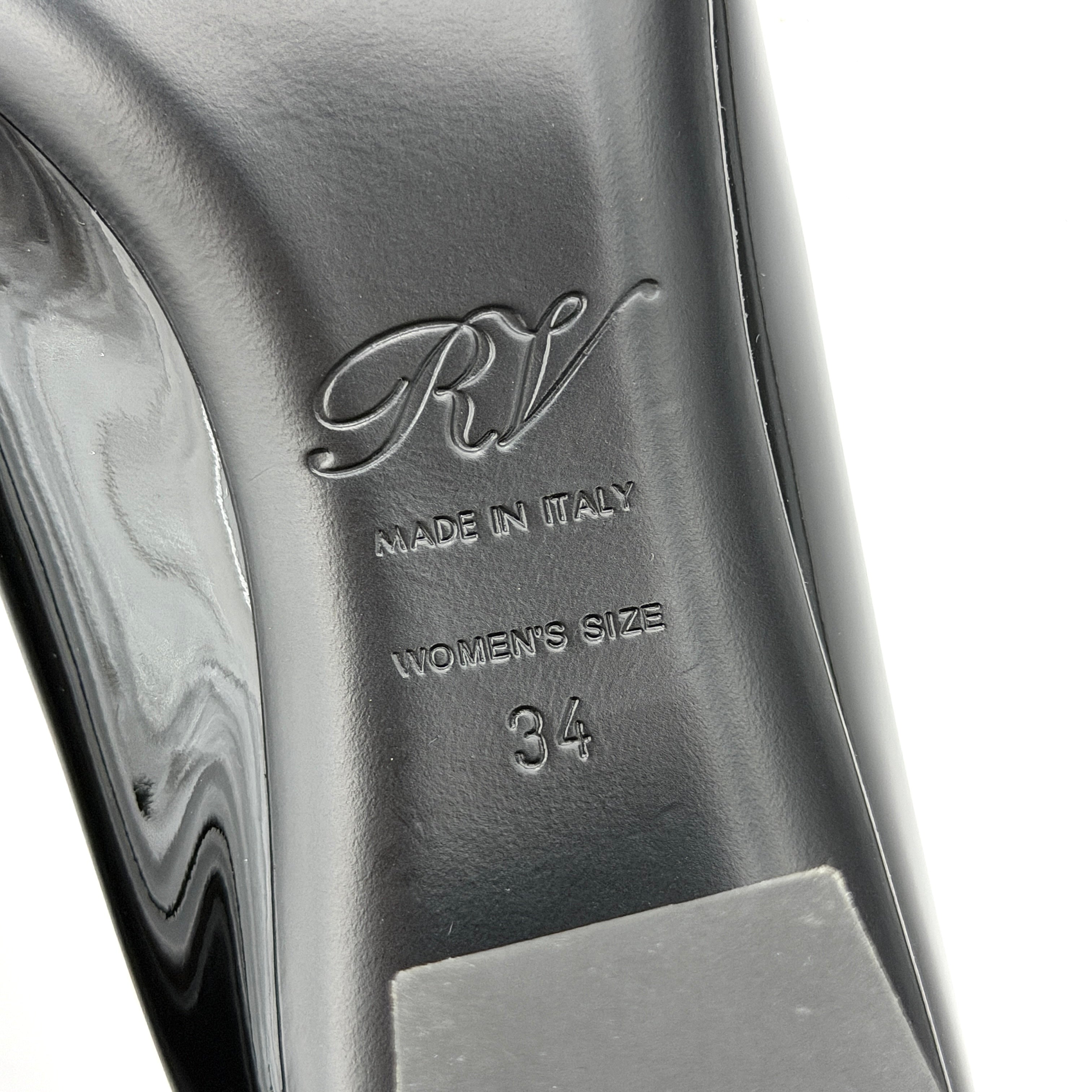 A pair of Roger Vivier Belle Vivier black patent pumps with signature silver-tone buckles, displayed at an angle.