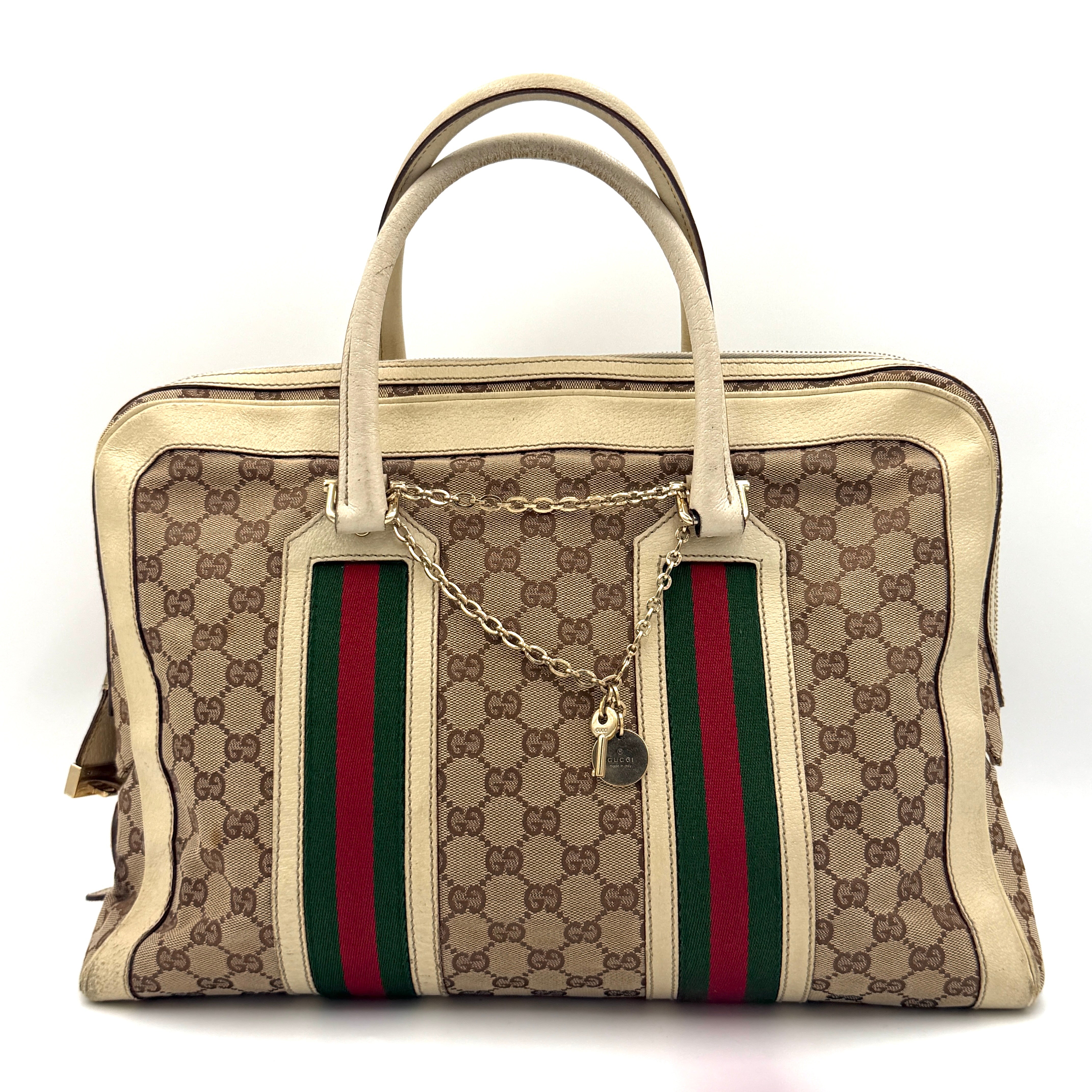 Gucci GG Monogram Stoffa Shoulder Bag in beige canvas with cream leather trim, iconic web stripes, and gold-tone chain detail.
