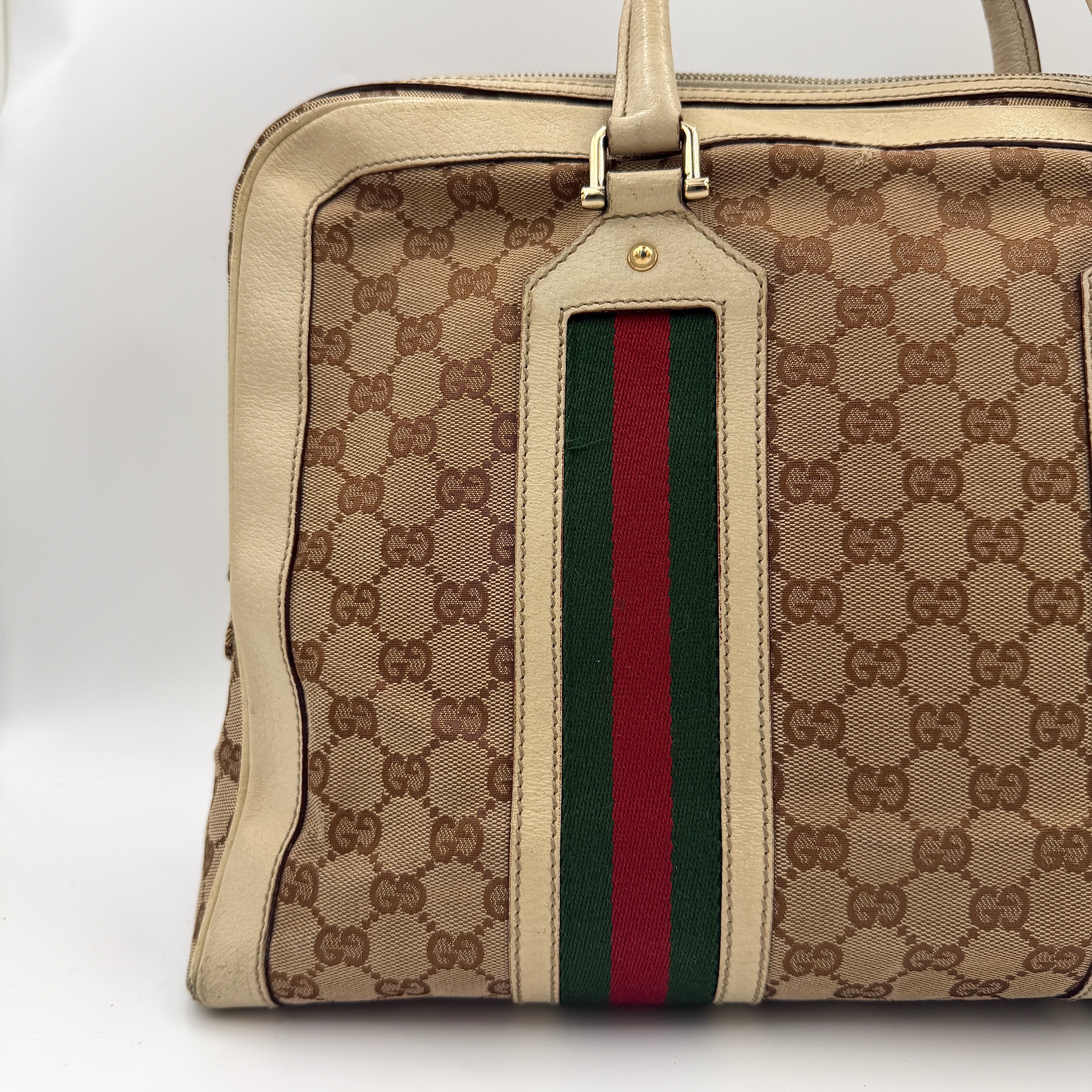 Gucci GG Monogram Stoffa Shoulder Bag in beige canvas with cream leather trim, iconic web stripes, and gold-tone chain detail.