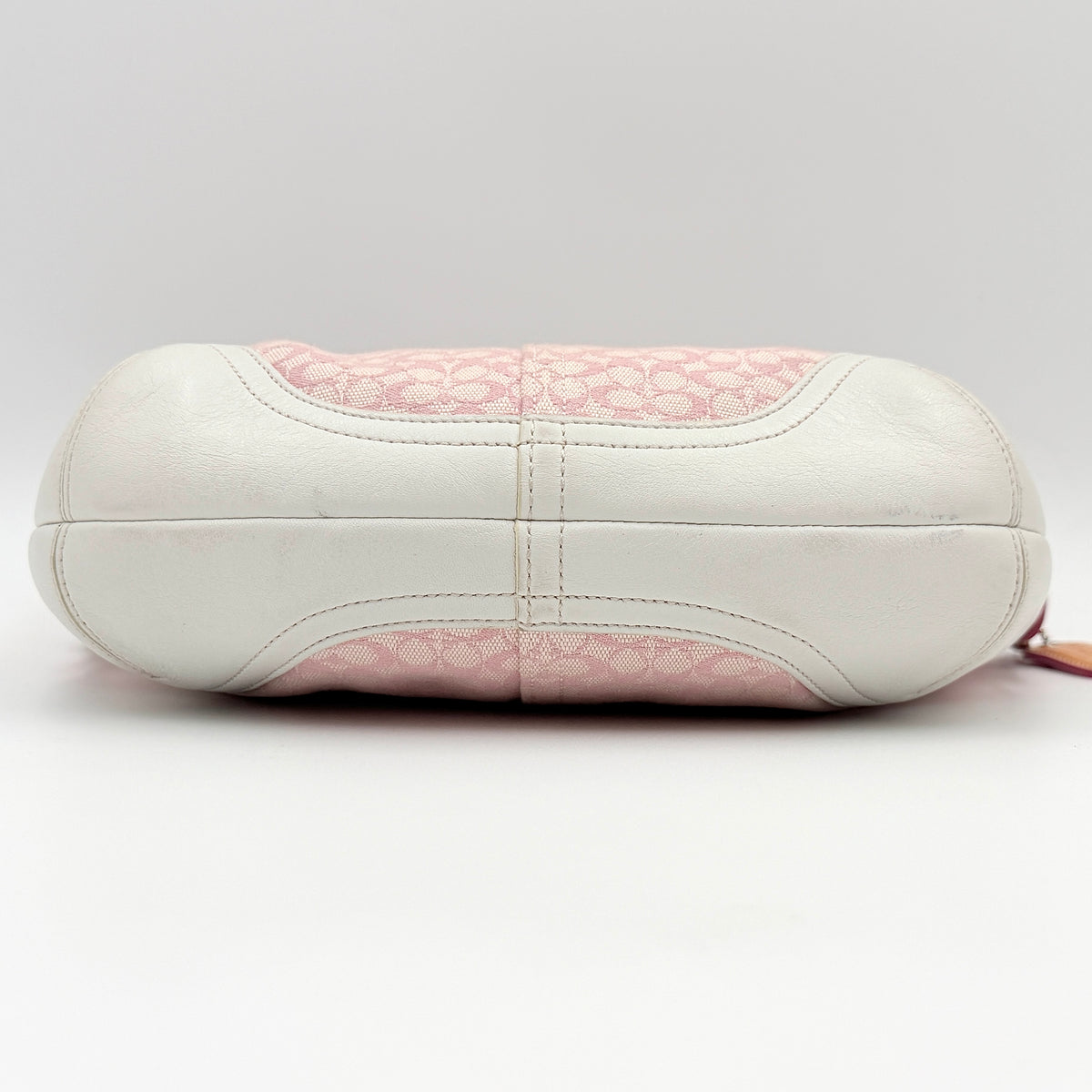 Coach Y2K Signature Hobo Shoulder Bag in pink jacquard with tan and white leather trim, shown on a white background.