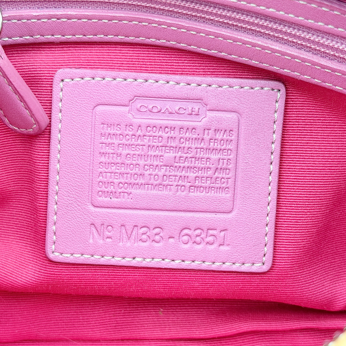 Coach Y2K Signature Hobo Shoulder Bag in pink jacquard with tan and white leather trim, shown on a white background.