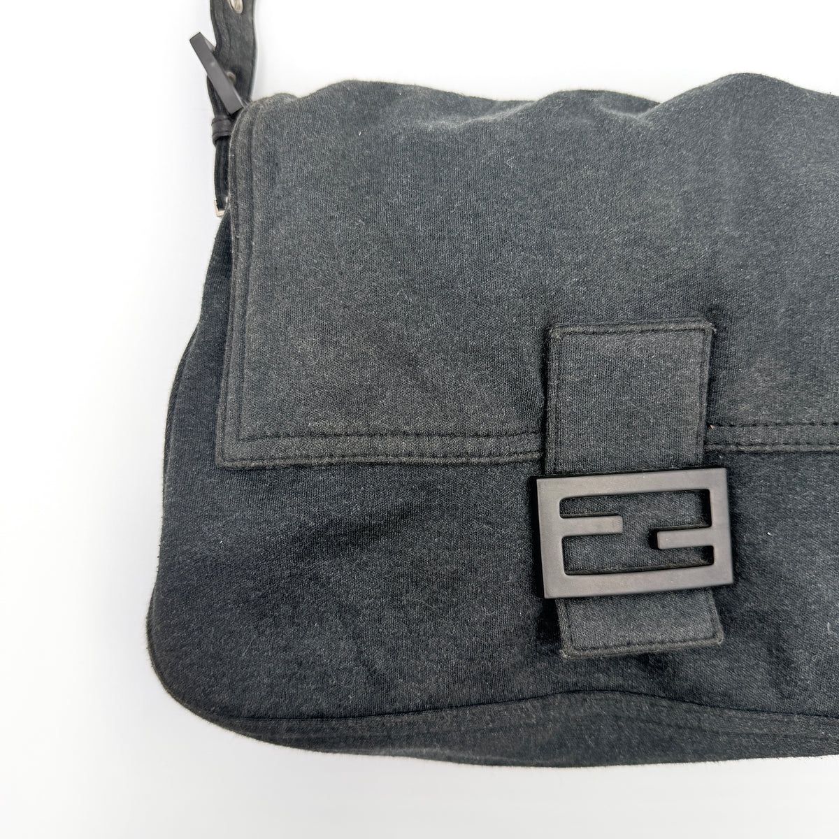 Fendi Mamma Baguette in grey textile with matte FF plaque, shown with original yellow Fendi dust bag.