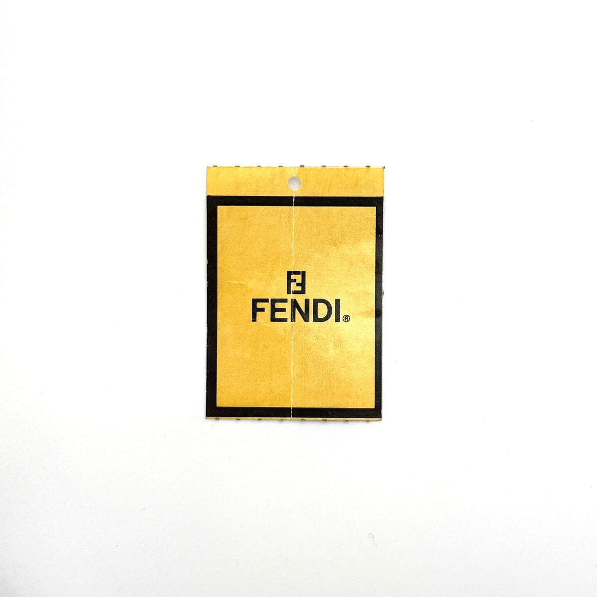 Fendi FF Zucca Double Zip Tote Bag in brown monogram canvas with leather straps and side pocket detail, shown on a yellow dust bag.
