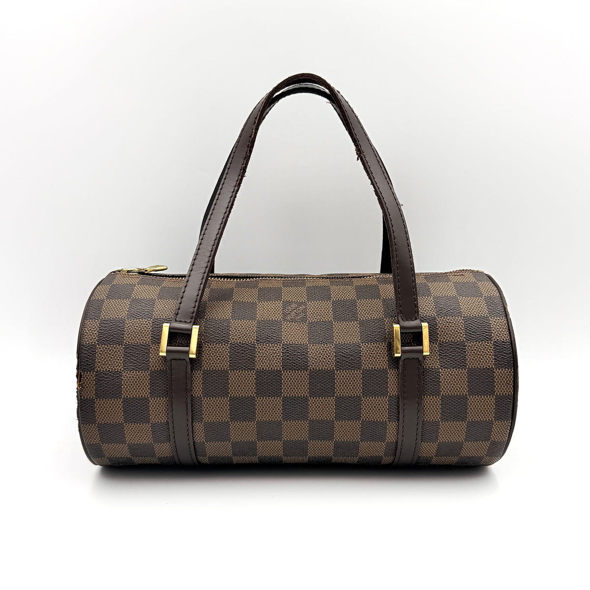 Louis Vuitton Damier Ebene Papillon 26 handbag in brown checked canvas with chocolate leather handles and gold hardware against a white background.