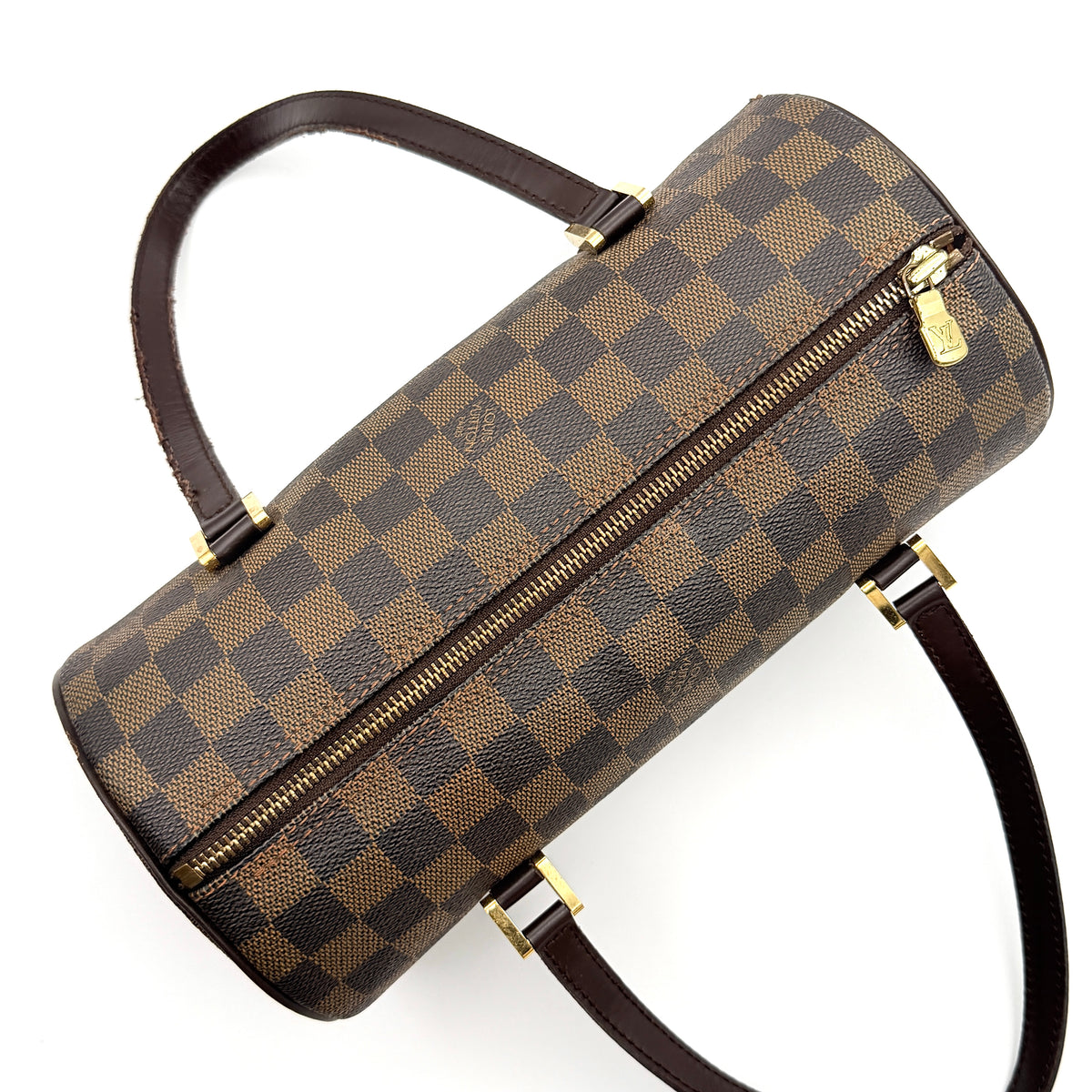 Louis Vuitton Damier Ebene Papillon 26 handbag in brown checked canvas with chocolate leather handles and gold hardware against a white background.