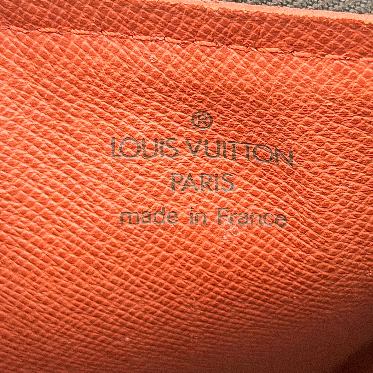 Louis Vuitton Damier Ebene Papillon 26 handbag in brown checked canvas with chocolate leather handles and gold hardware against a white background.