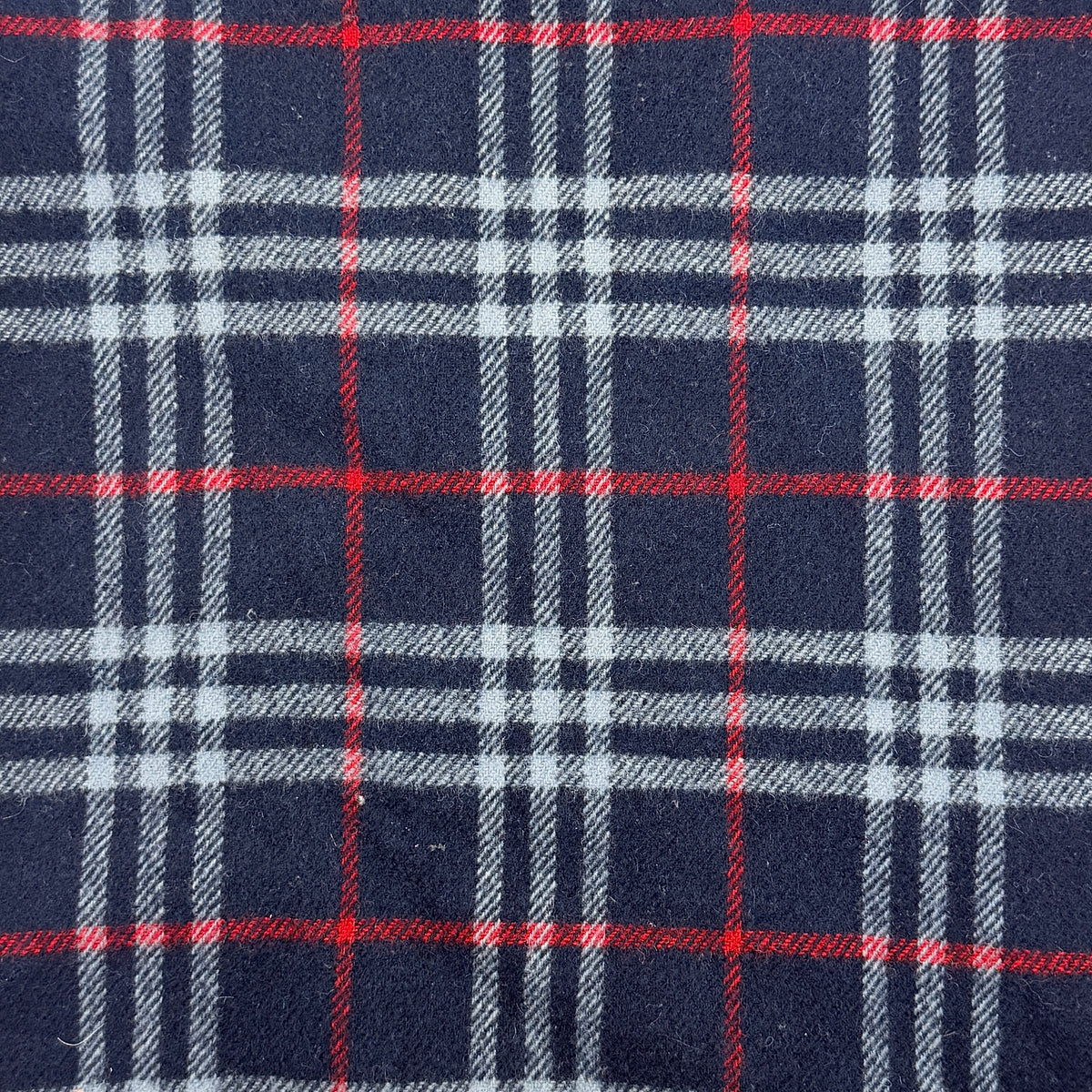 Burberrys navy Nova Check lambswool shawl scarf with tassel ends, shown folded against a white background.