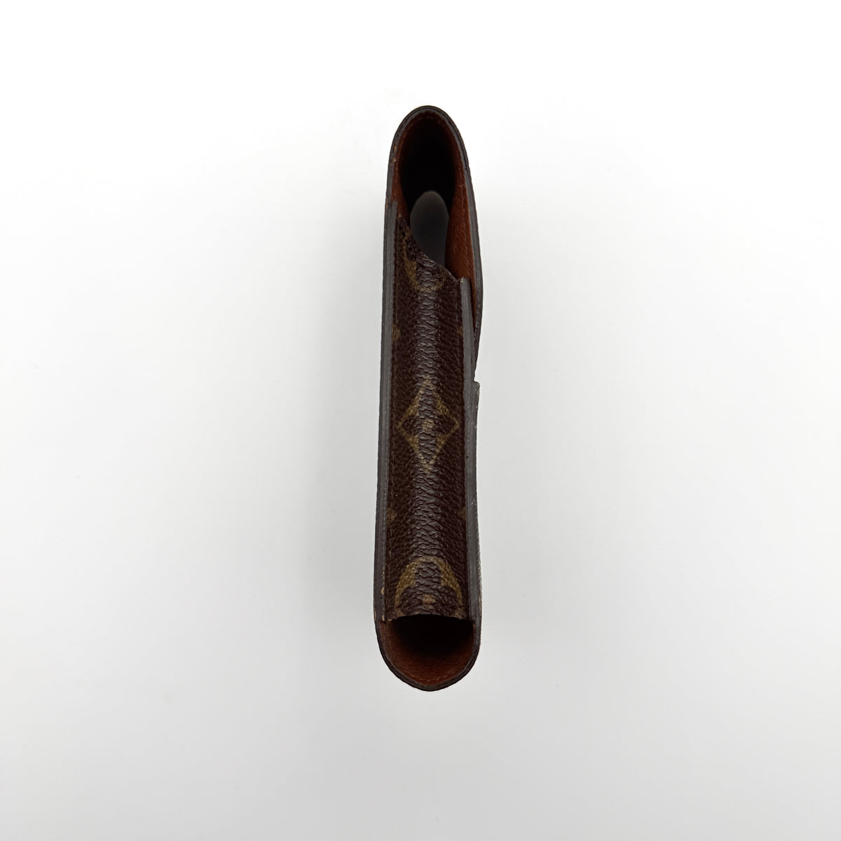 Louis Vuitton monogram brown cigarette case with flap closure on white background