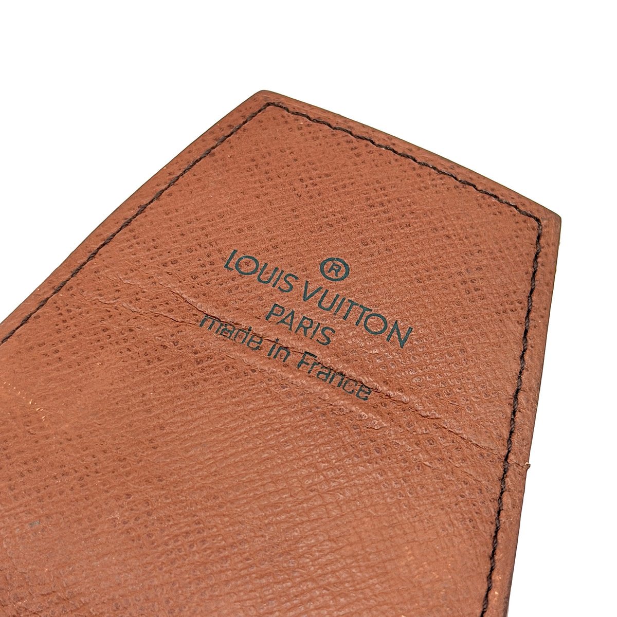 Louis Vuitton monogram brown cigarette case with flap closure on white background