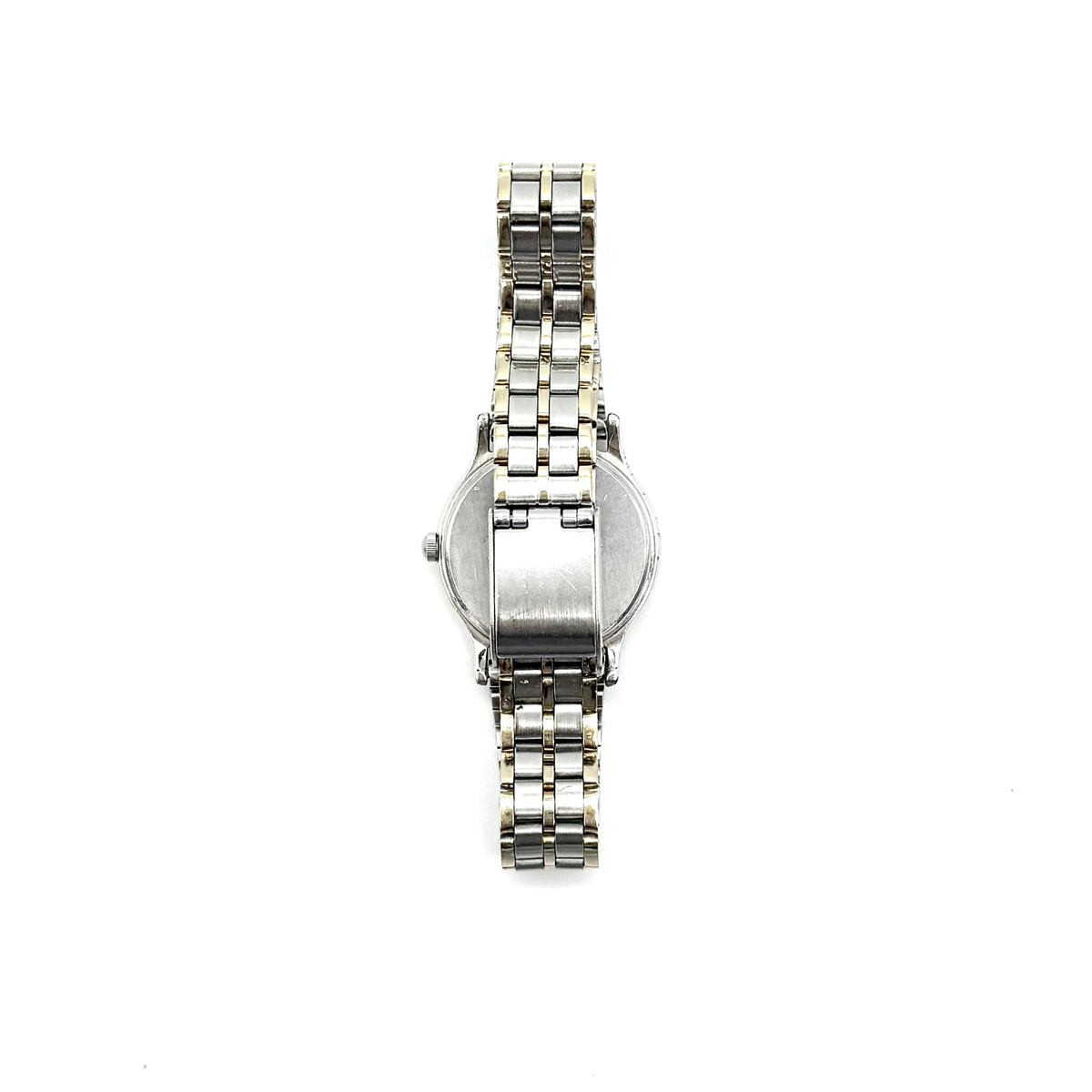 Seiko Spirit quartz watch with a white dial and two-tone stainless steel bracelet in silver and gold, displayed upright on a clear stand.