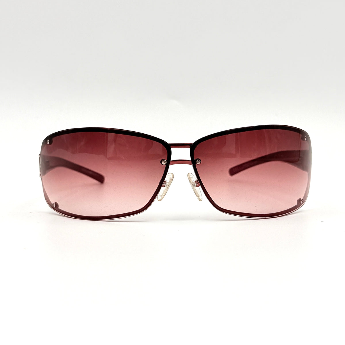 Emporio Armani EA 9251/S sunglasses in translucent red with gradient lenses and silver-tone logo detail at the temple.
