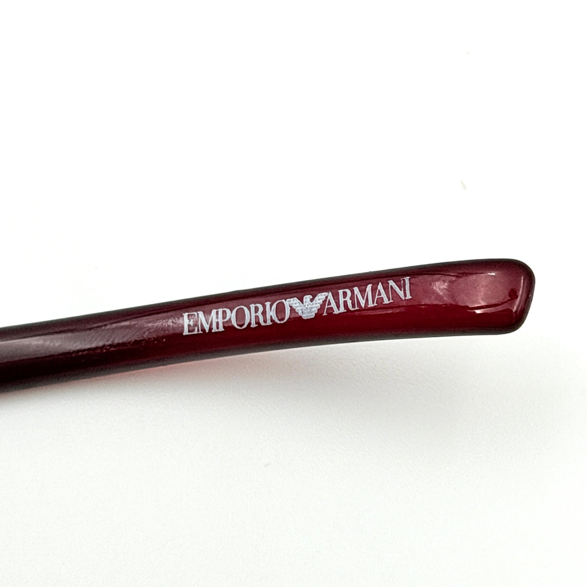Emporio Armani EA 9251/S sunglasses in translucent red with gradient lenses and silver-tone logo detail at the temple.