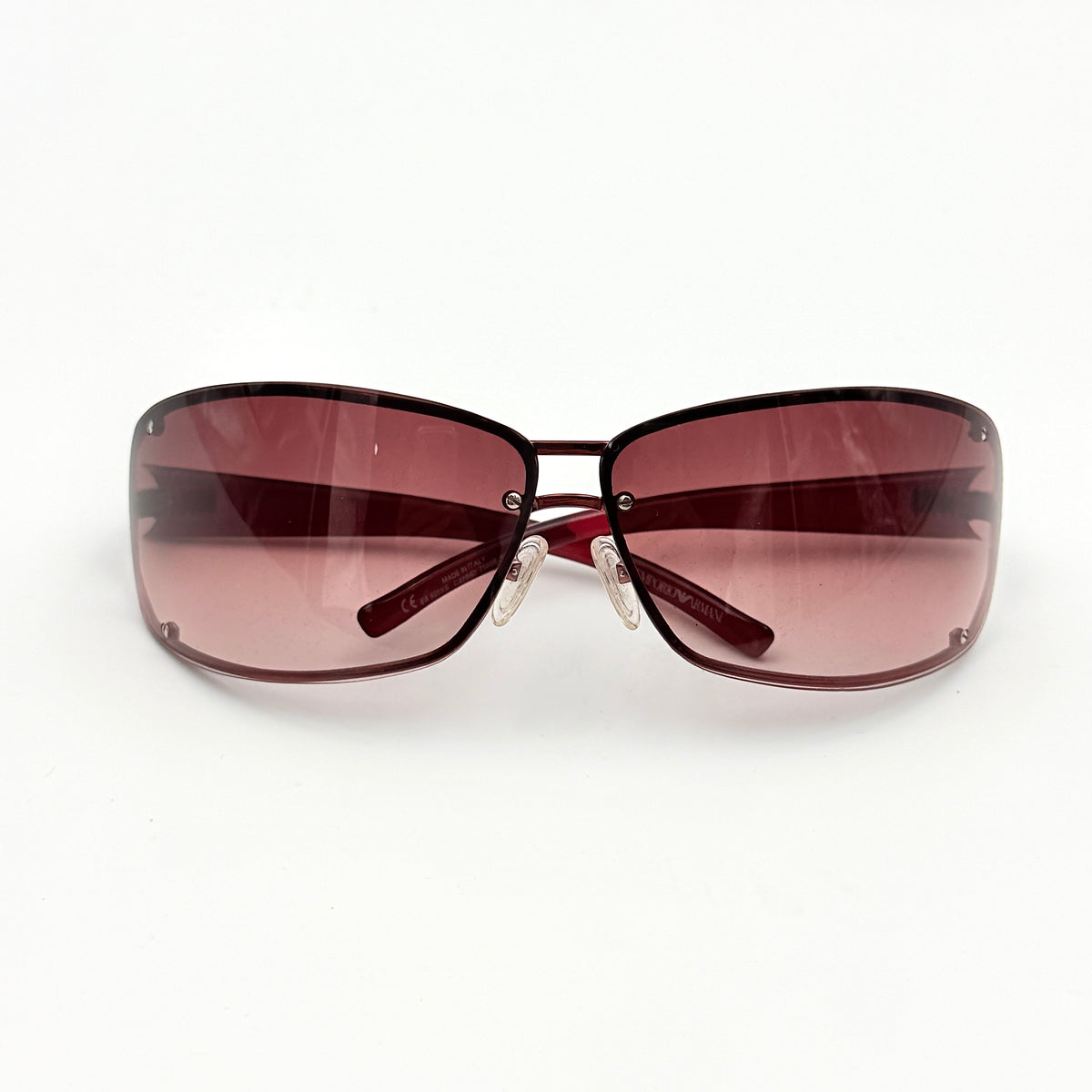 Emporio Armani EA 9251/S sunglasses in translucent red with gradient lenses and silver-tone logo detail at the temple.