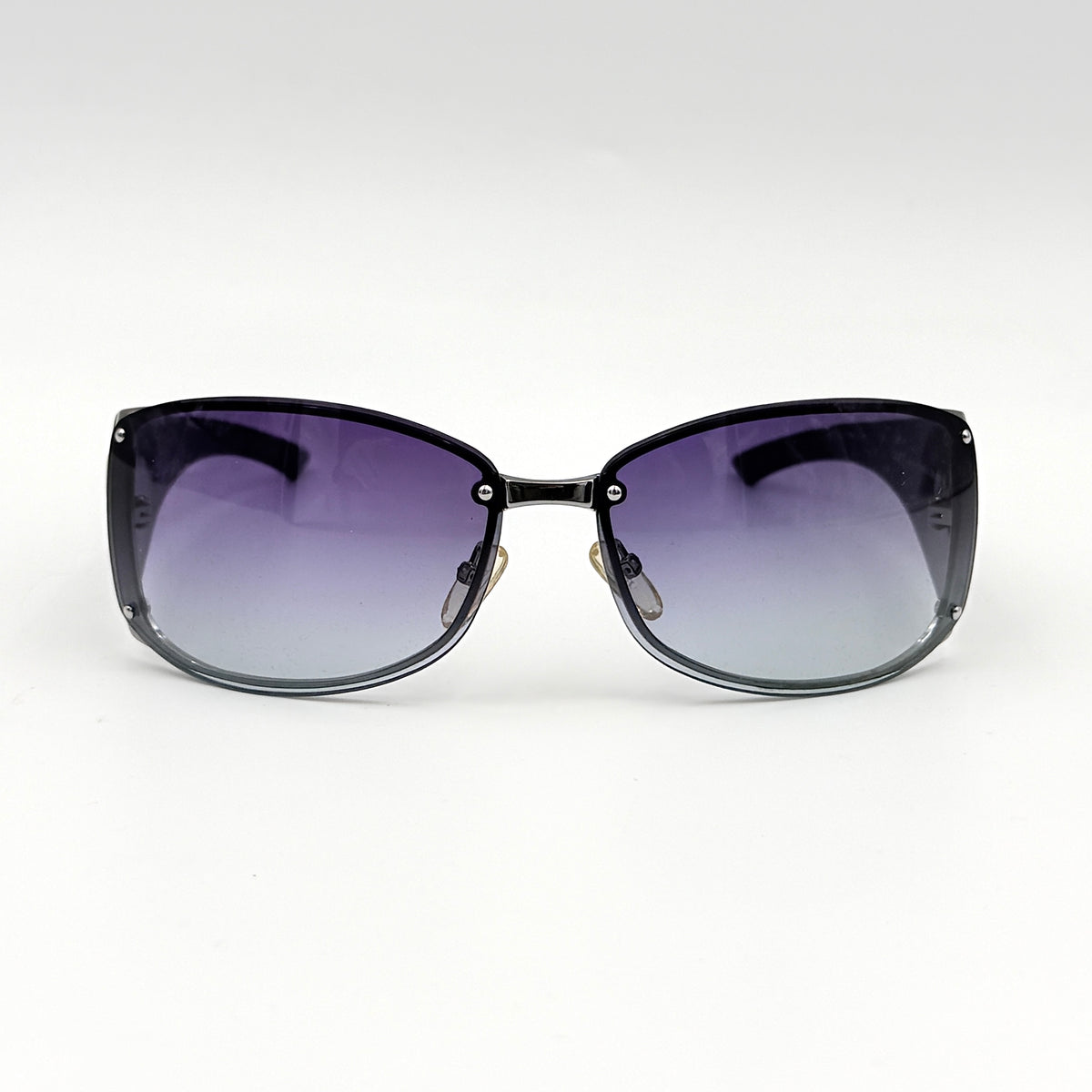 Christian Dior SUBDIOR 1/F sunglasses in navy blue with wide arms, gradient lenses, and silver-tone logo detail at the temples.