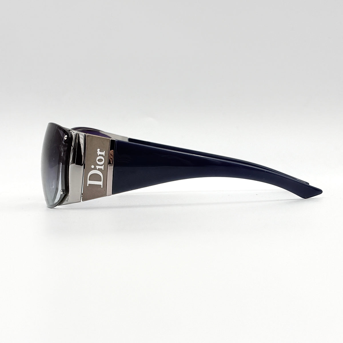 Christian Dior SUBDIOR 1/F sunglasses in navy blue with wide arms, gradient lenses, and silver-tone logo detail at the temples.