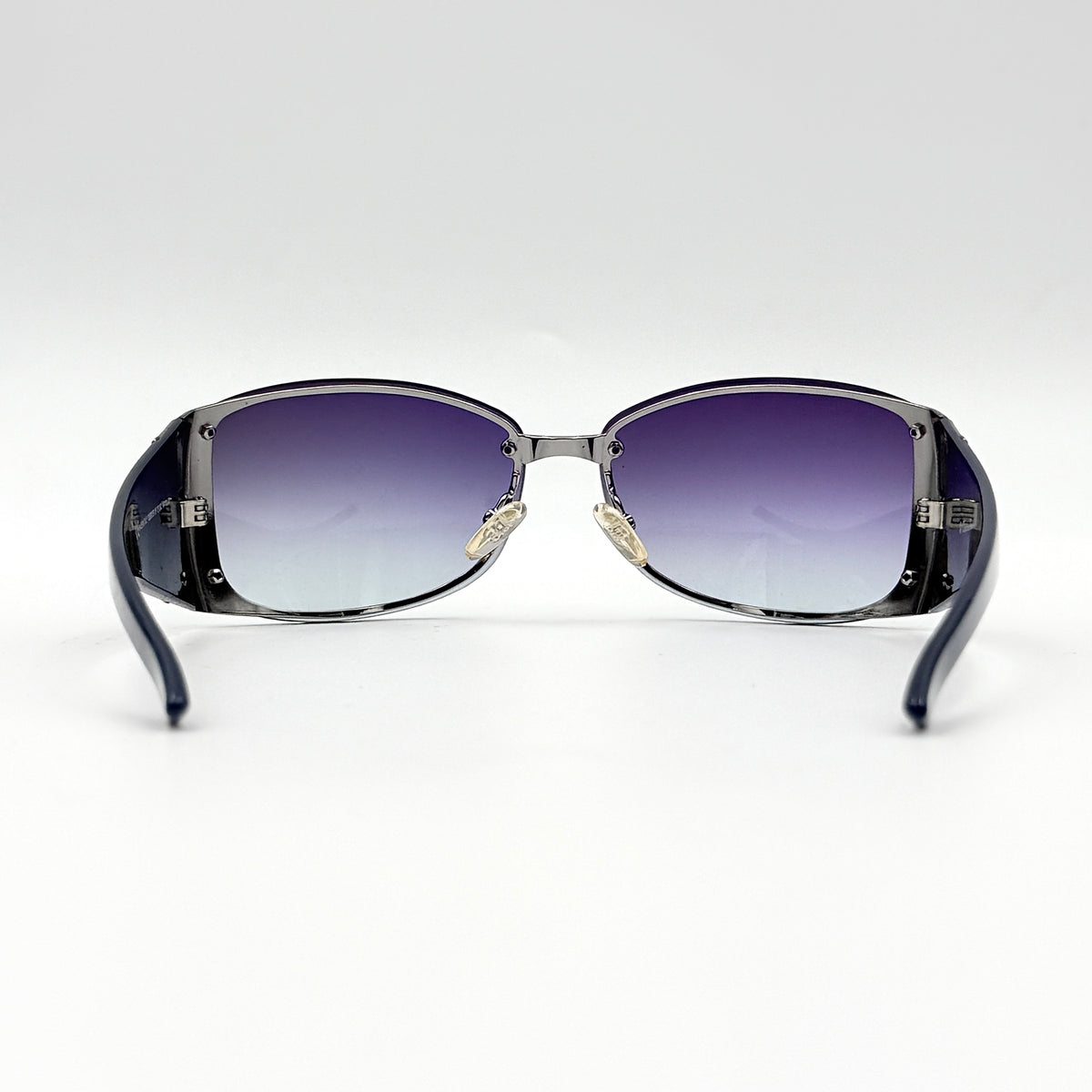Christian Dior SUBDIOR 1/F sunglasses in navy blue with wide arms, gradient lenses, and silver-tone logo detail at the temples.