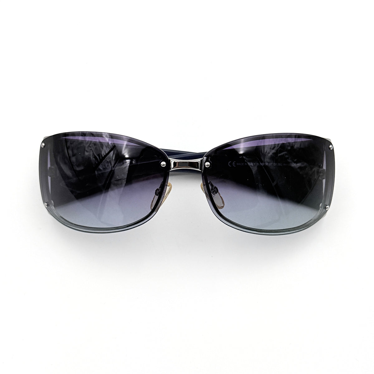 Christian Dior SUBDIOR 1/F sunglasses in navy blue with wide arms, gradient lenses, and silver-tone logo detail at the temples.