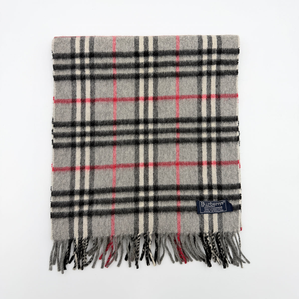 Burberry grey cashmere scarf with Nova Check pattern and classic fringe, featuring a Burberrys of London label.