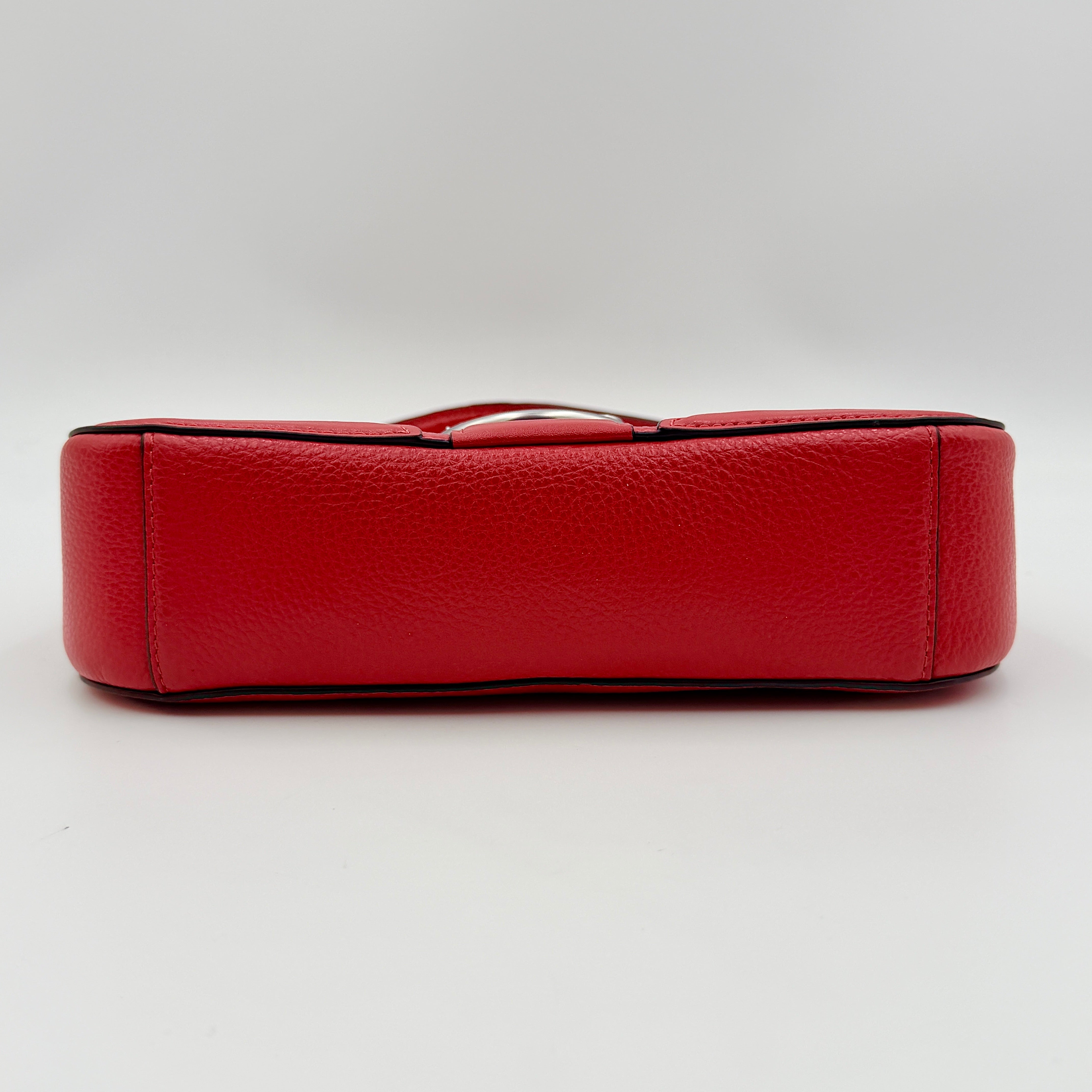 Coach 2Way Georgie Baguette in red pebbled leather with silver carriage logo hardware, shown with removable shoulder strap.